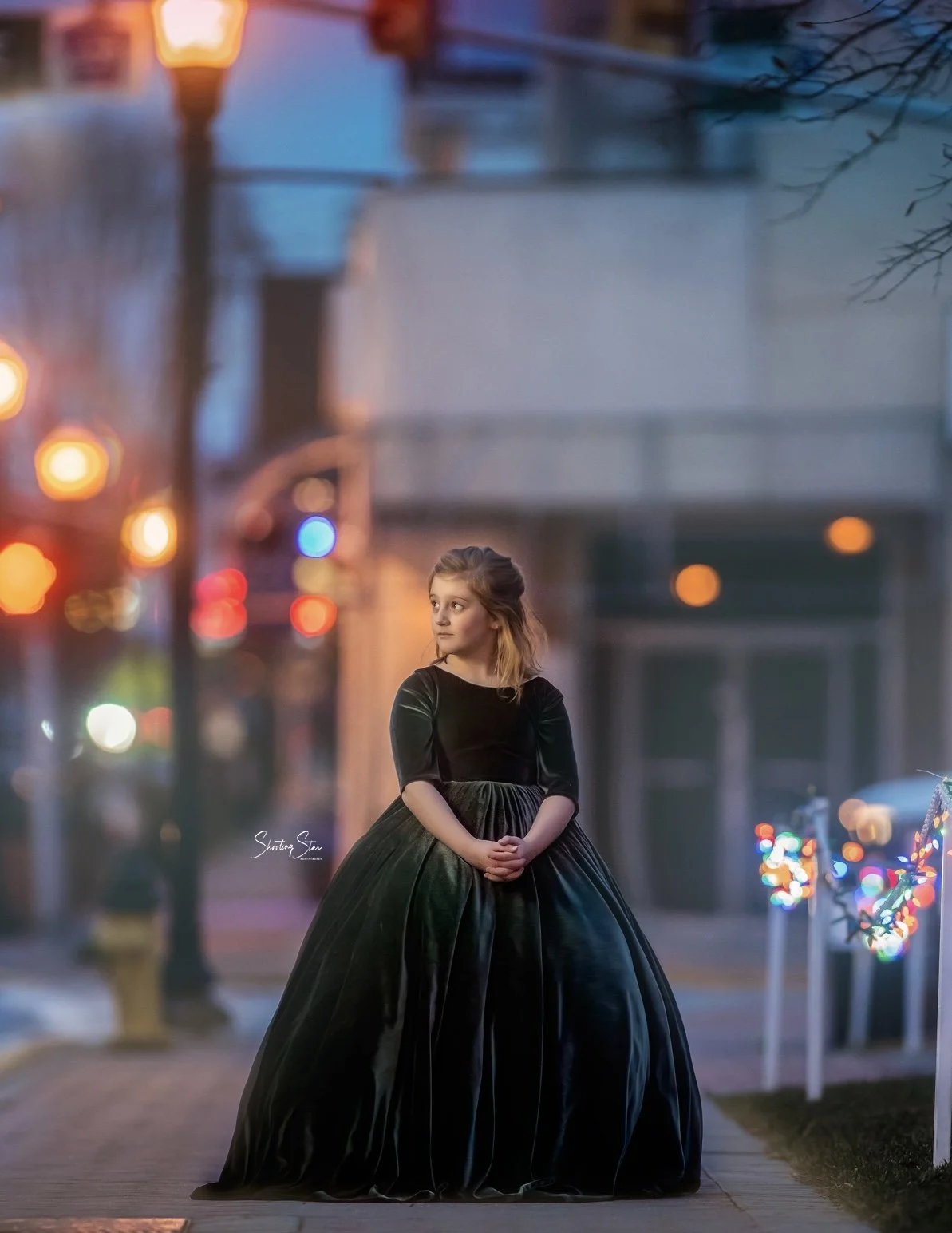 Young girl portrait in downtown Pitman New Jersey with soft bokeh lights and evening glow