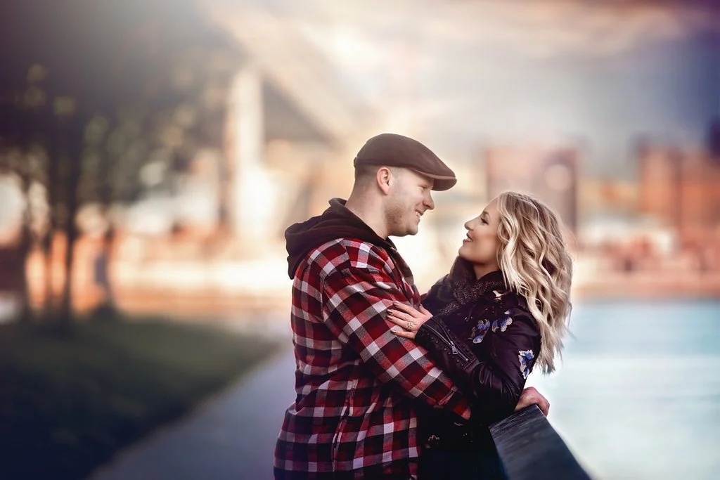 Engaged couple sharing a loving look during their winter engagement session at Race Street Pier