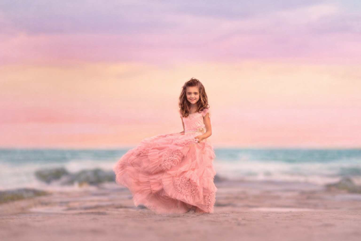 girl twirling in pink dress during a sunset beach portrait session in Ocean City NJ