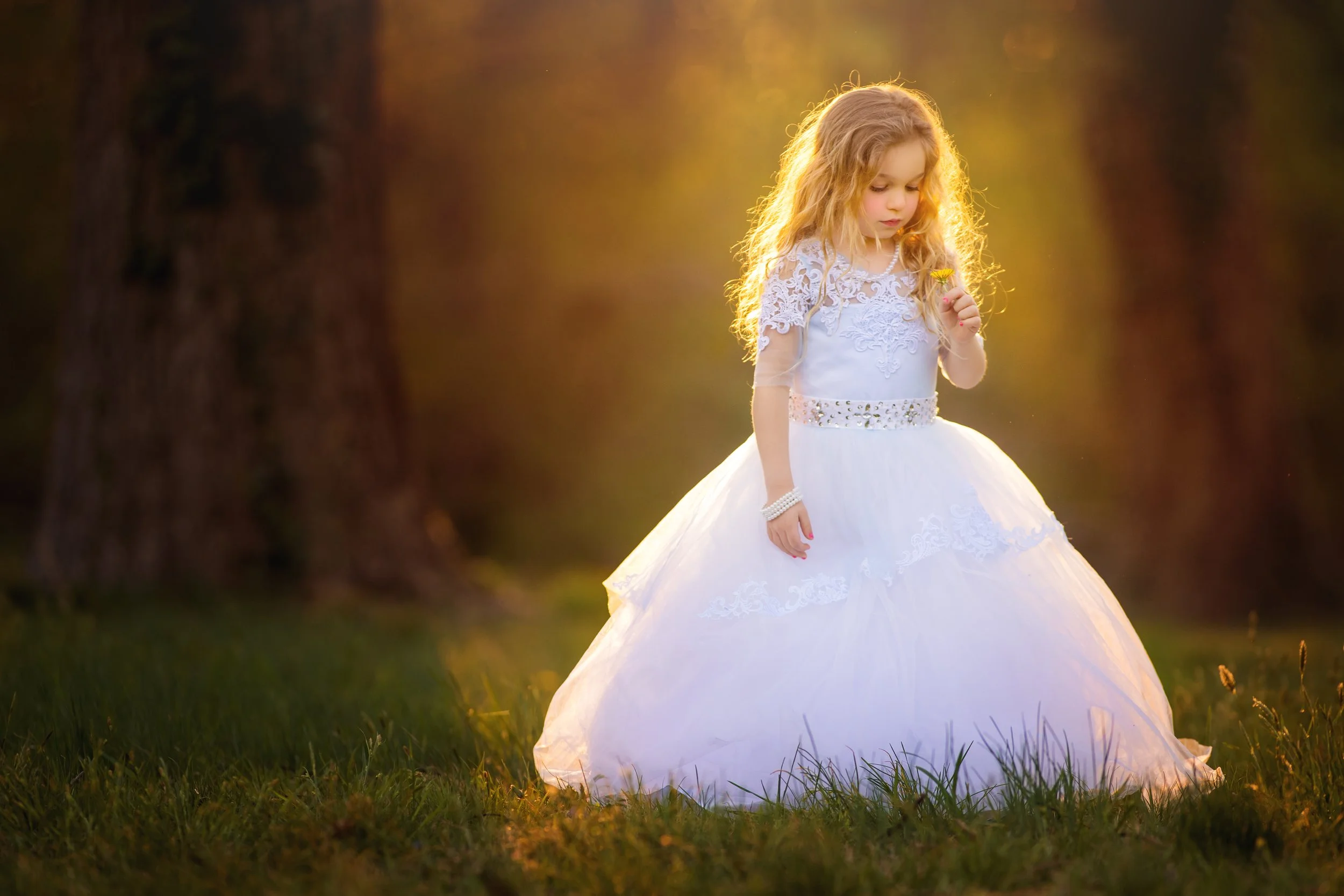 Young girl photographed in soft natural light during a fine art child portrait session in Philadelphia