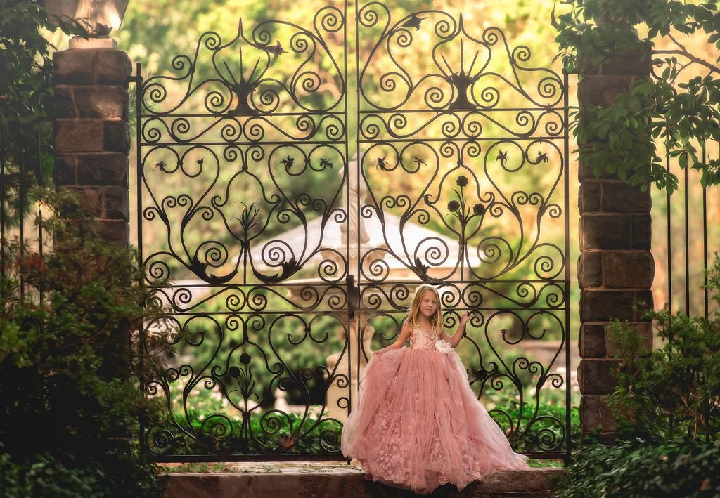 girl-in-pink-gown-at-garden-gate-mary-coffin-gardens.jpg