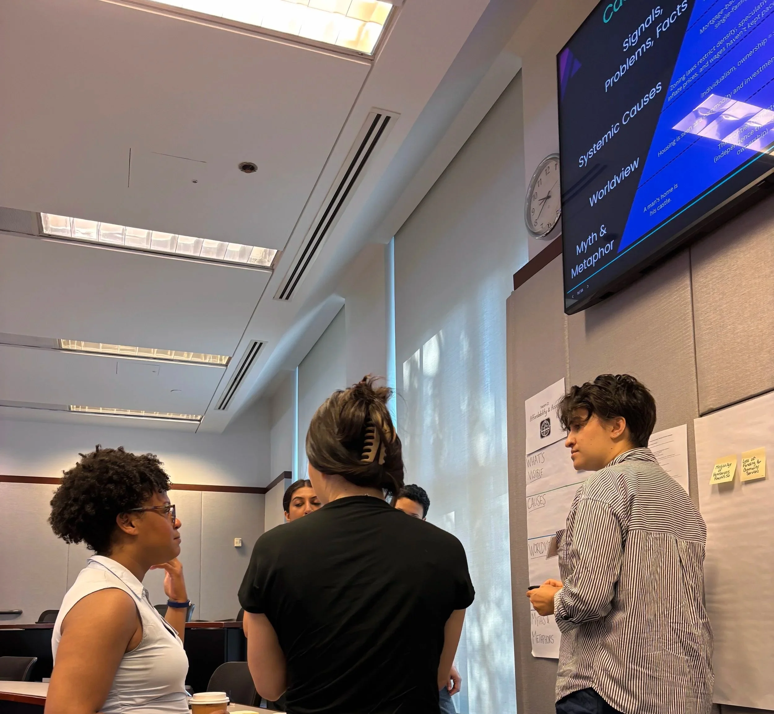 Participants exploring signals, systemic causes, and emerging change during an Empact Global foresight workshop.