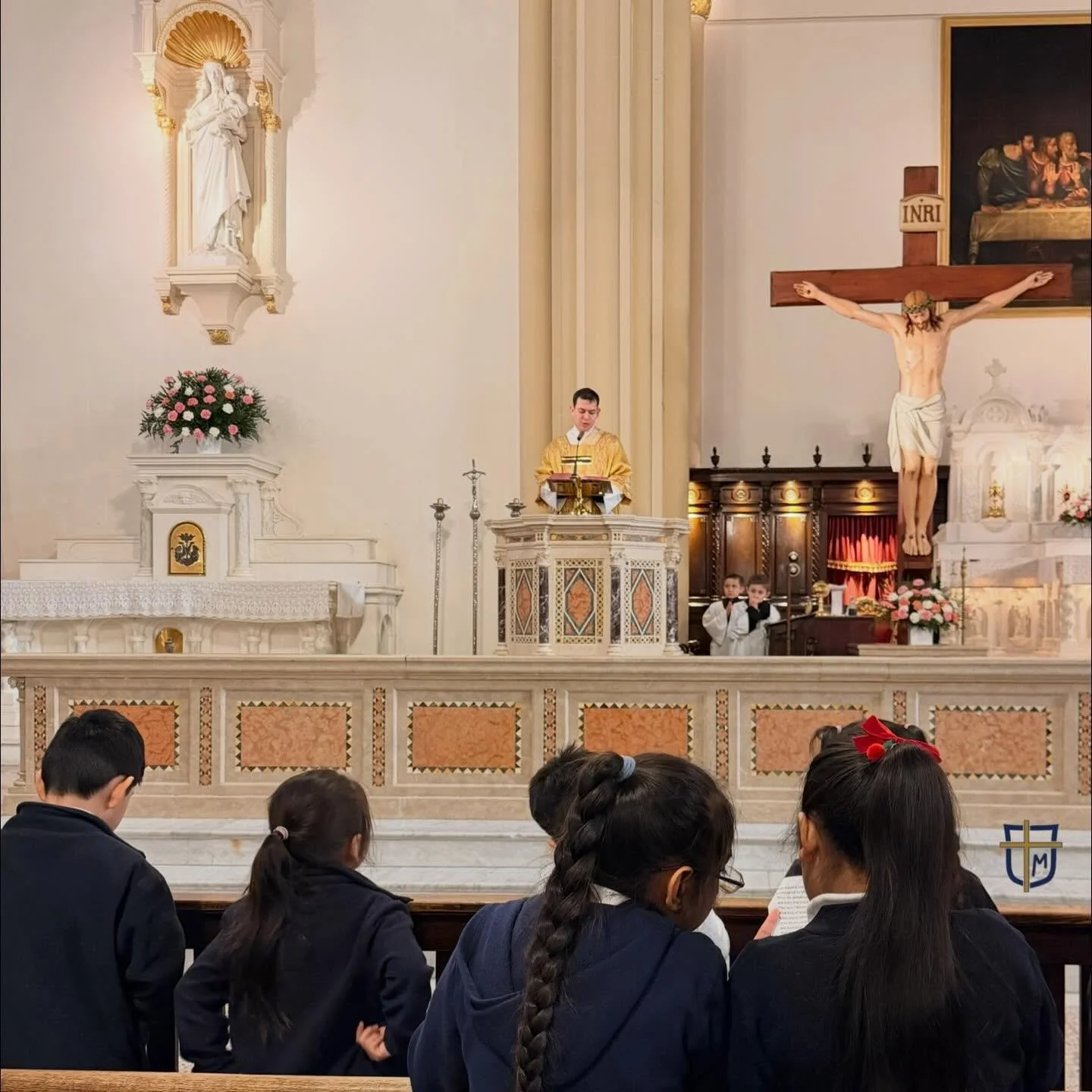 Students at Mass listening and following along to the Gospel. #nyccatholicschool #catholicschool #catholiceducation