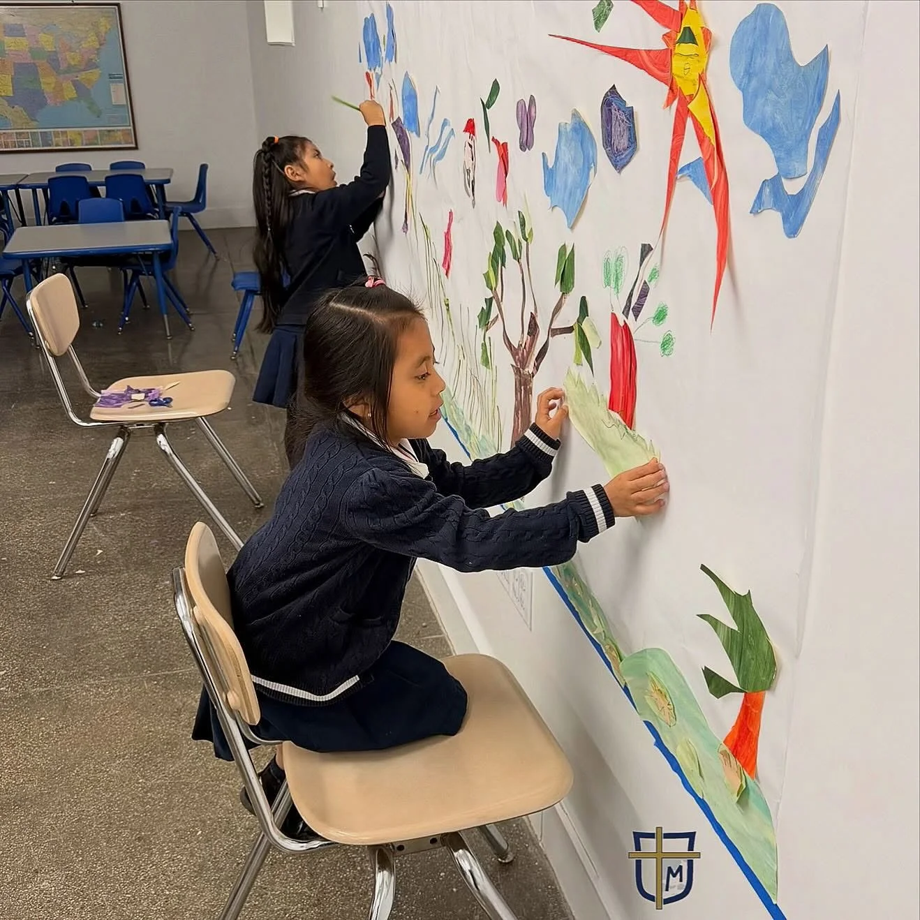 Kindergarten art class adding to our school mural. #littleartists #nyccatholicschool