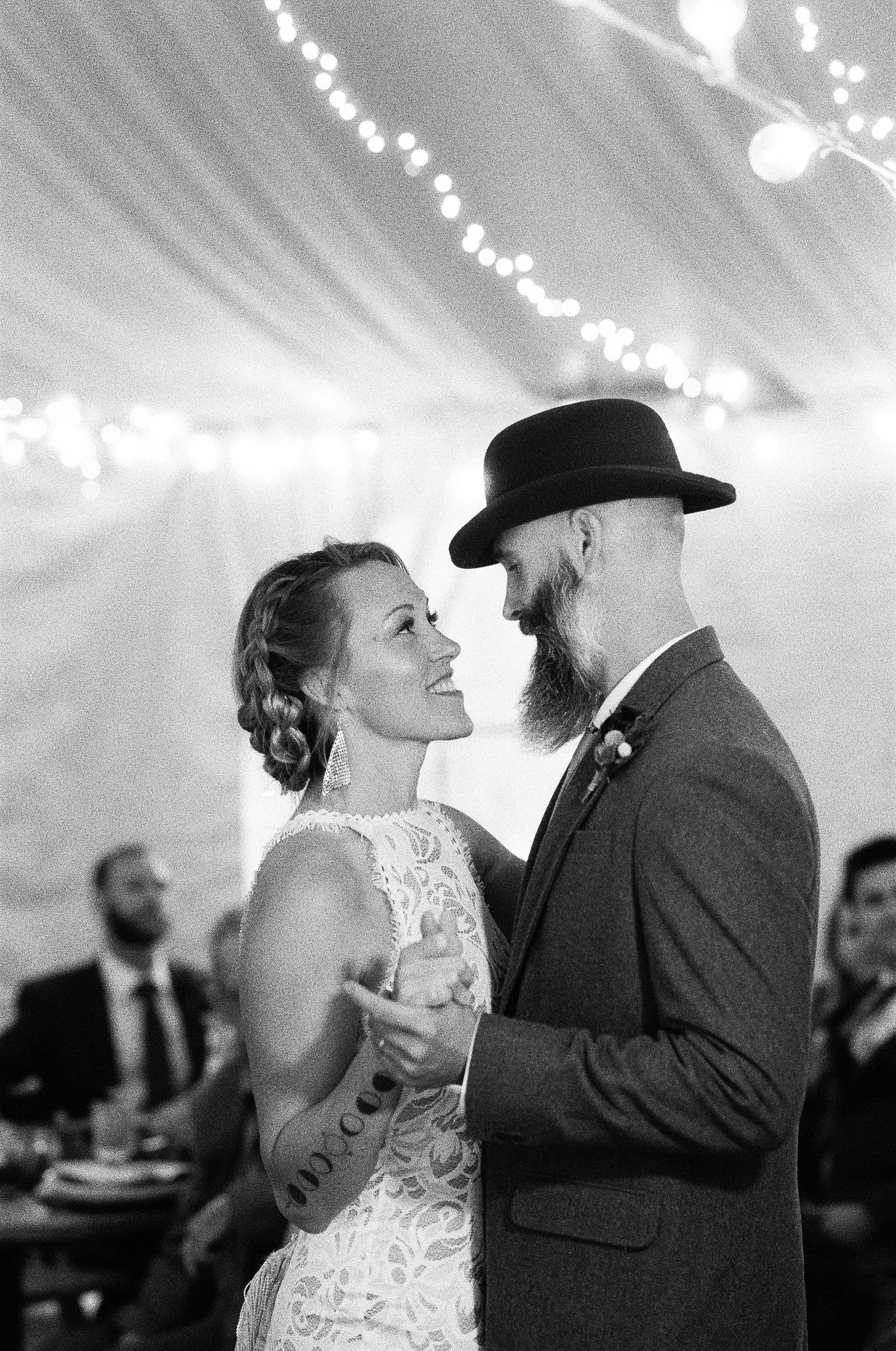 Bride and groom first dance black and white film
