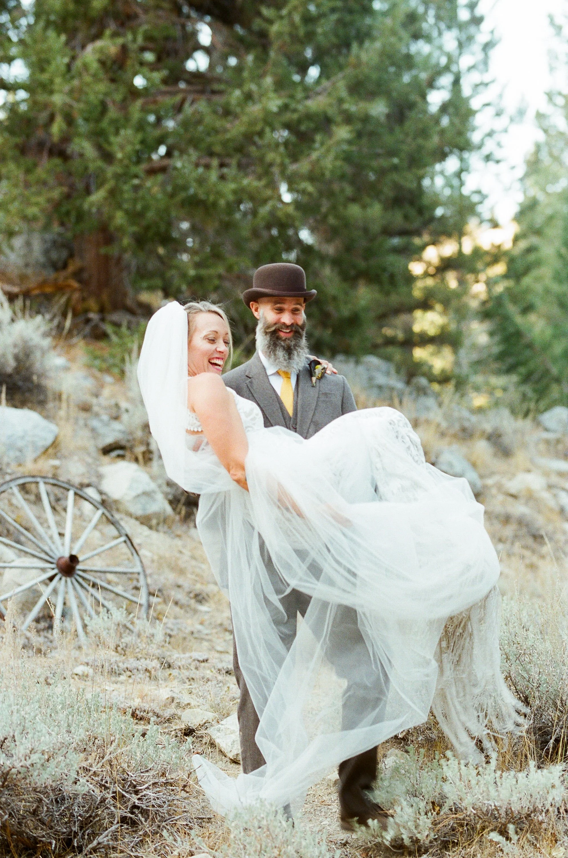Adventure elopement couple groom carrying bride