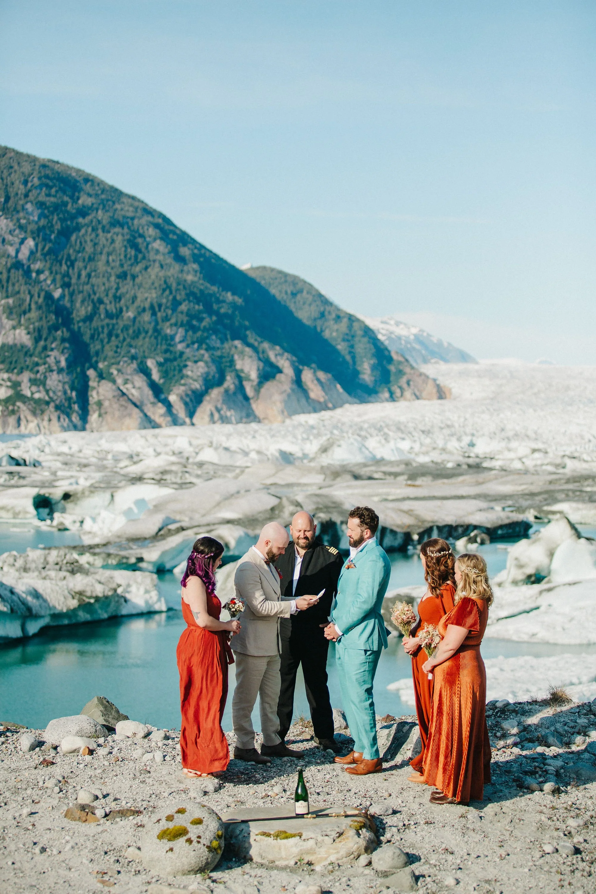 Adventure elopement ceremony in front of glacier