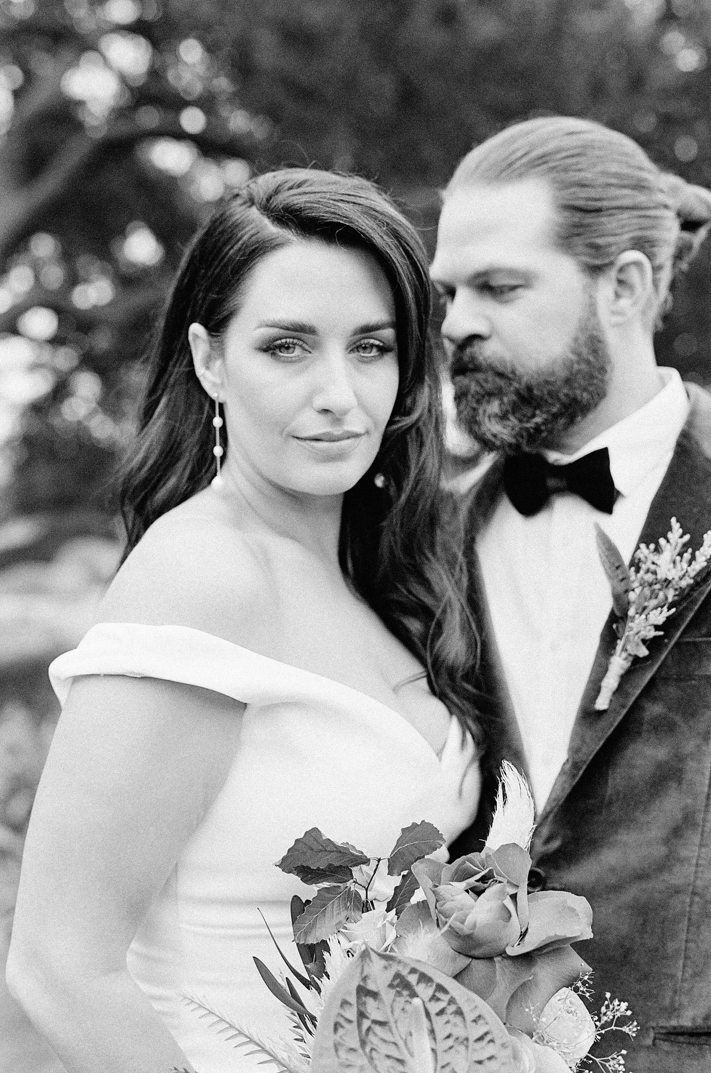 Dramatic black and white portrait of bride and groom