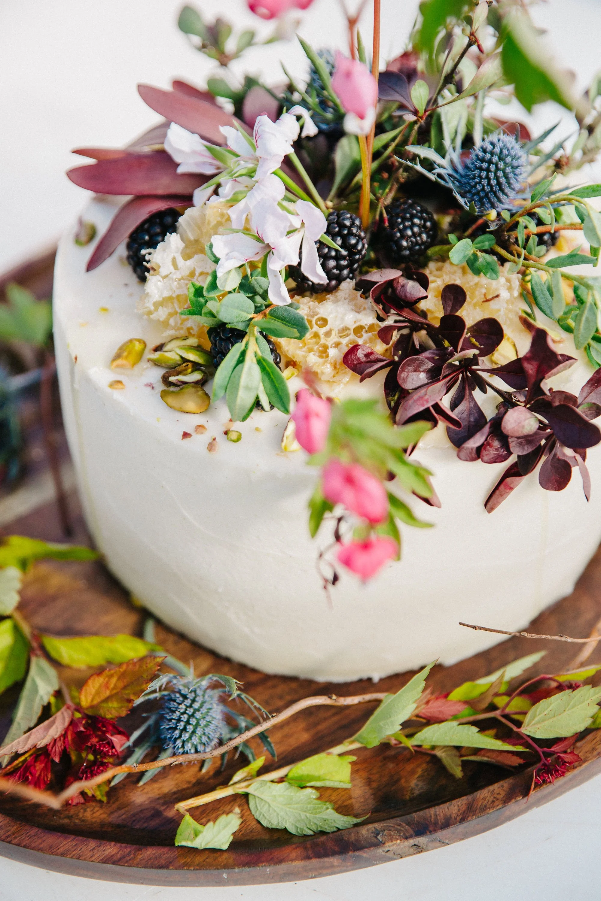 Alaska wedding cake with local florals baked by Salty Pantry
