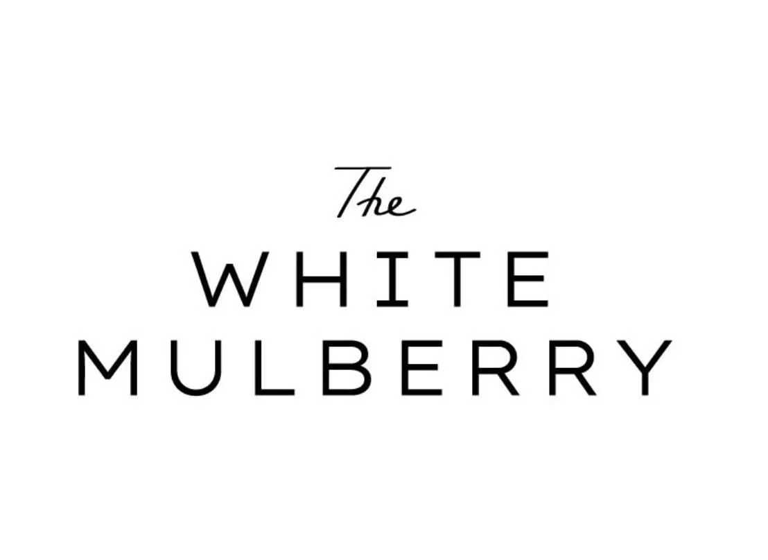 Text reading 'The White Mulberry' on a white background.