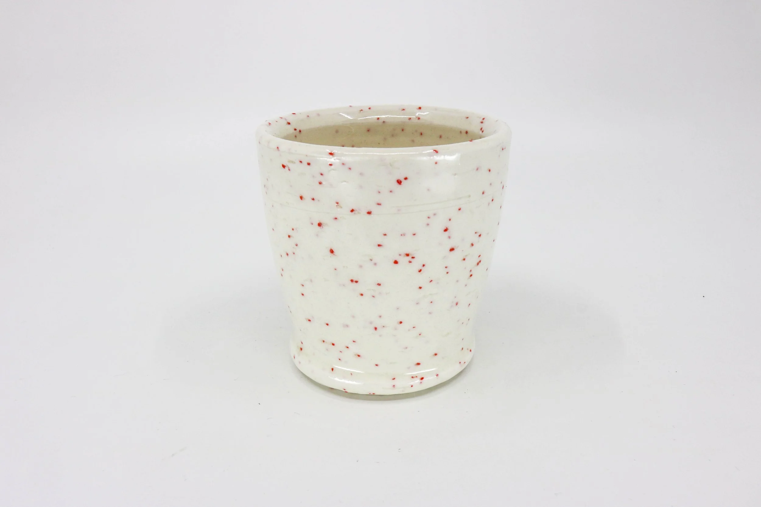 Fruit Punch M wedged into thrown porcelain with clear glaze. 