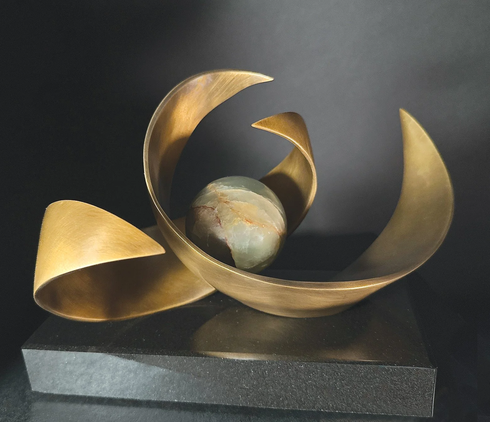 Lynn Dodge l Momentum IV l Bronze with black granite base l 7” x 10.5” 8"