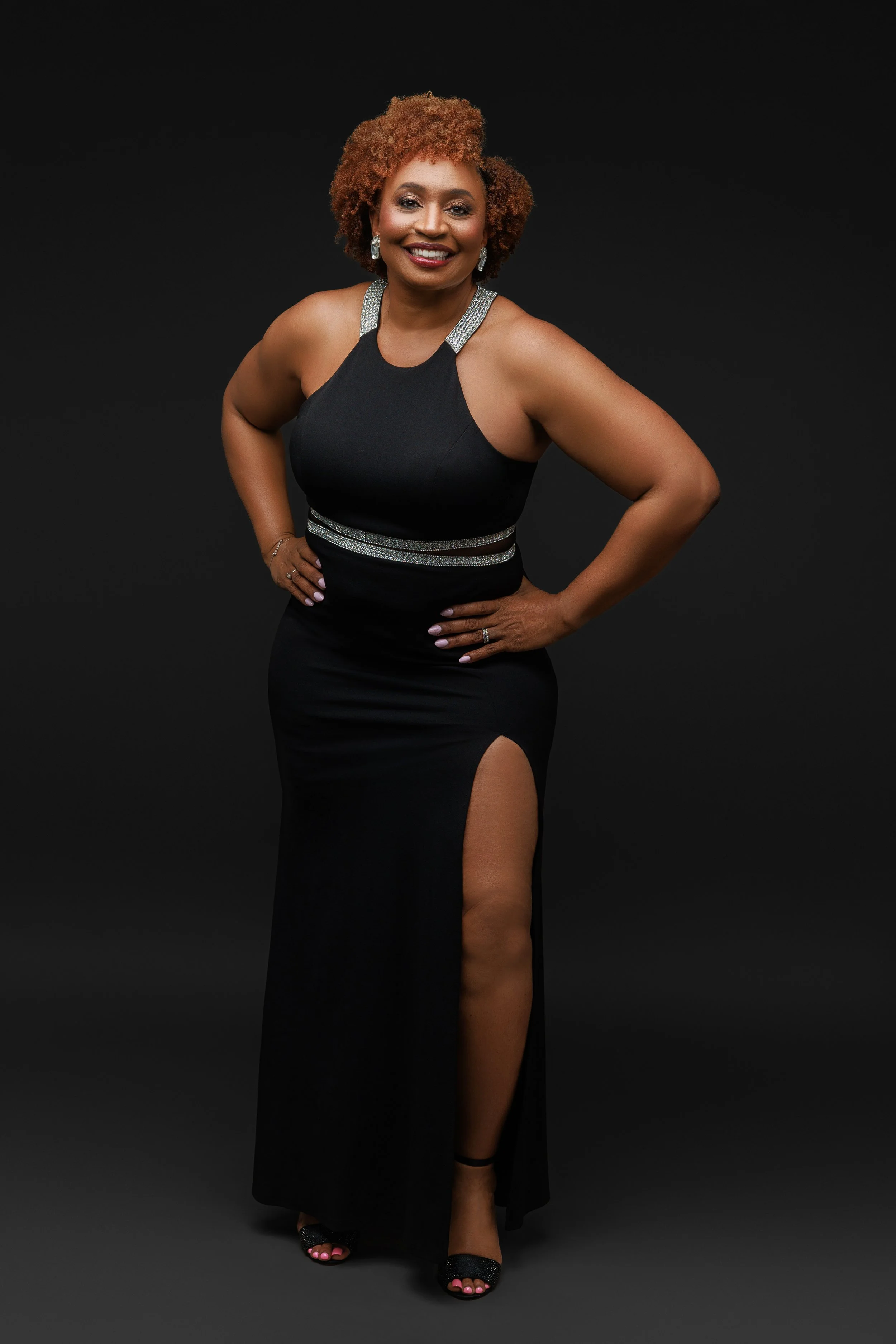 Full body portrait of woman in black dress during empowered women photoshoot in Memphis Tennessee