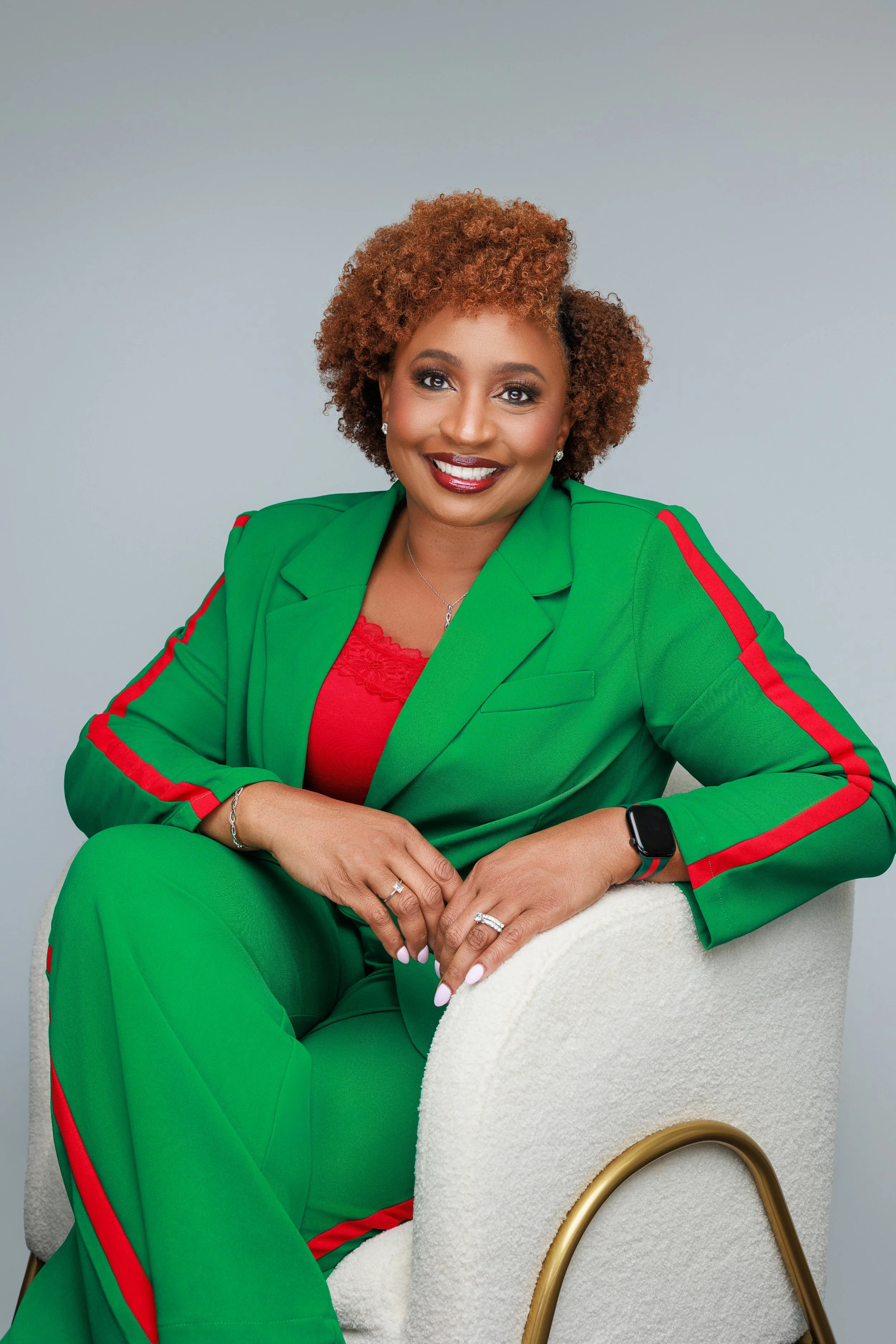 Confident woman in green suit during empowered women photoshoot at Hadonica’s Photography in Memphis Tennessee