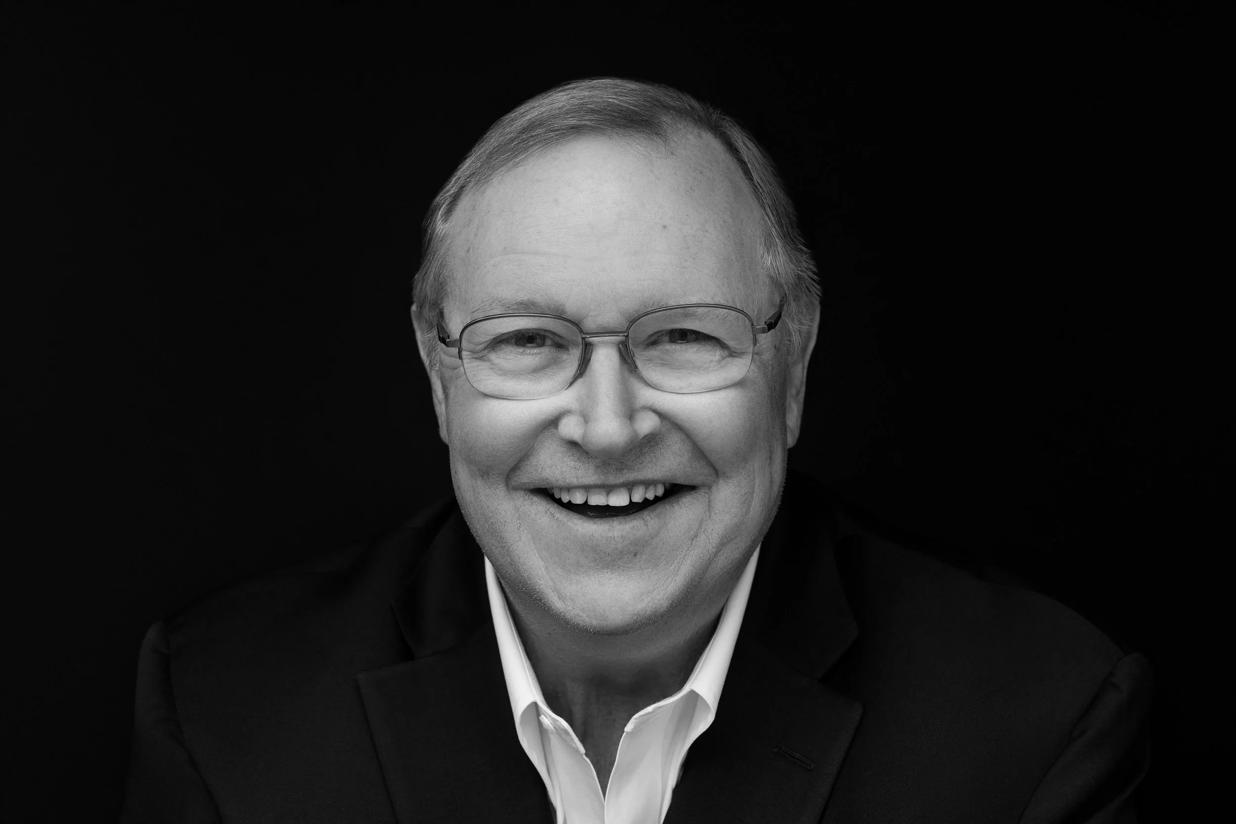 Financial advisor professional headshot smiling older male in suit Memphis TN studio portrait by Hadonica’s Photography
