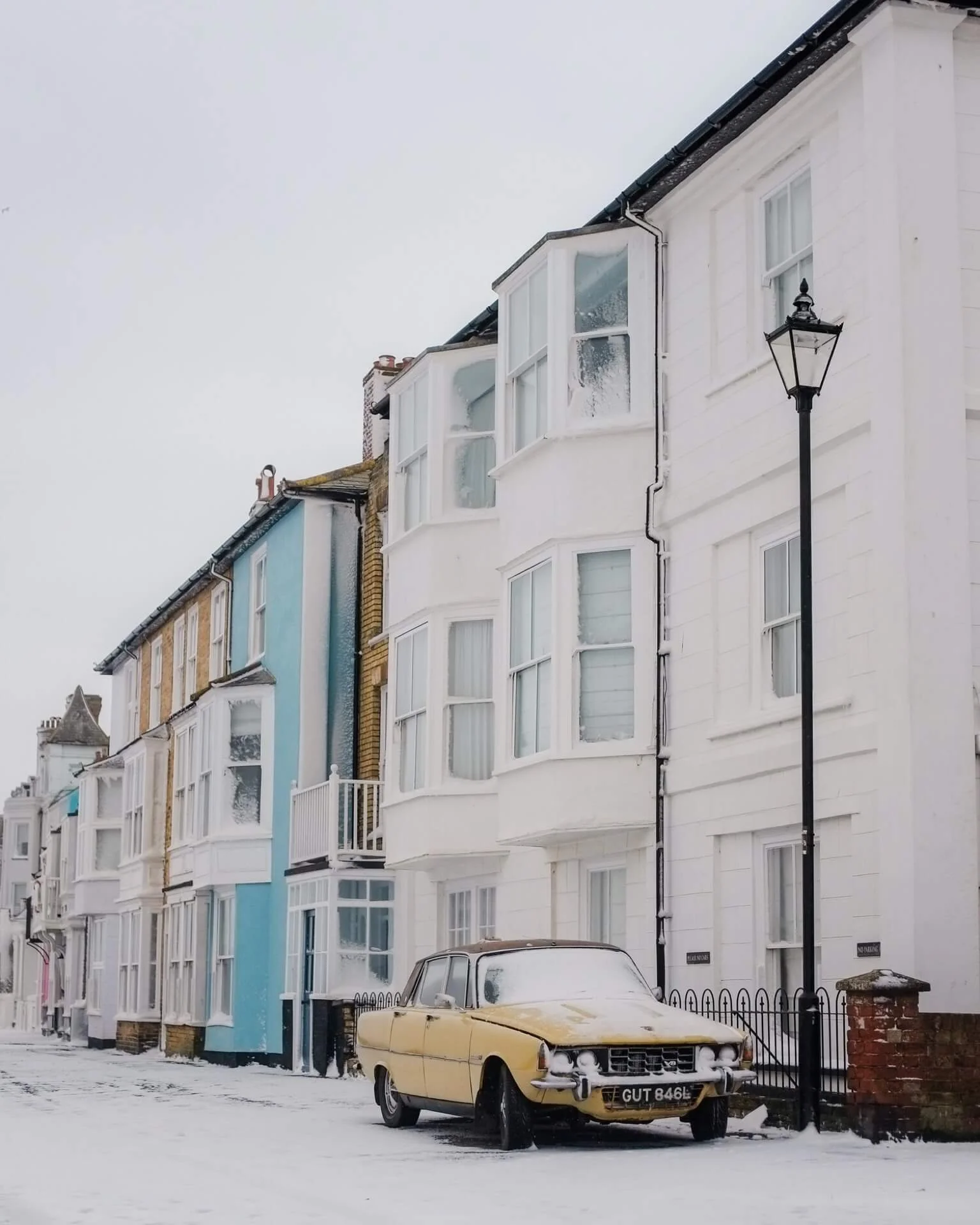 Vintage Car outside Coastal Houses