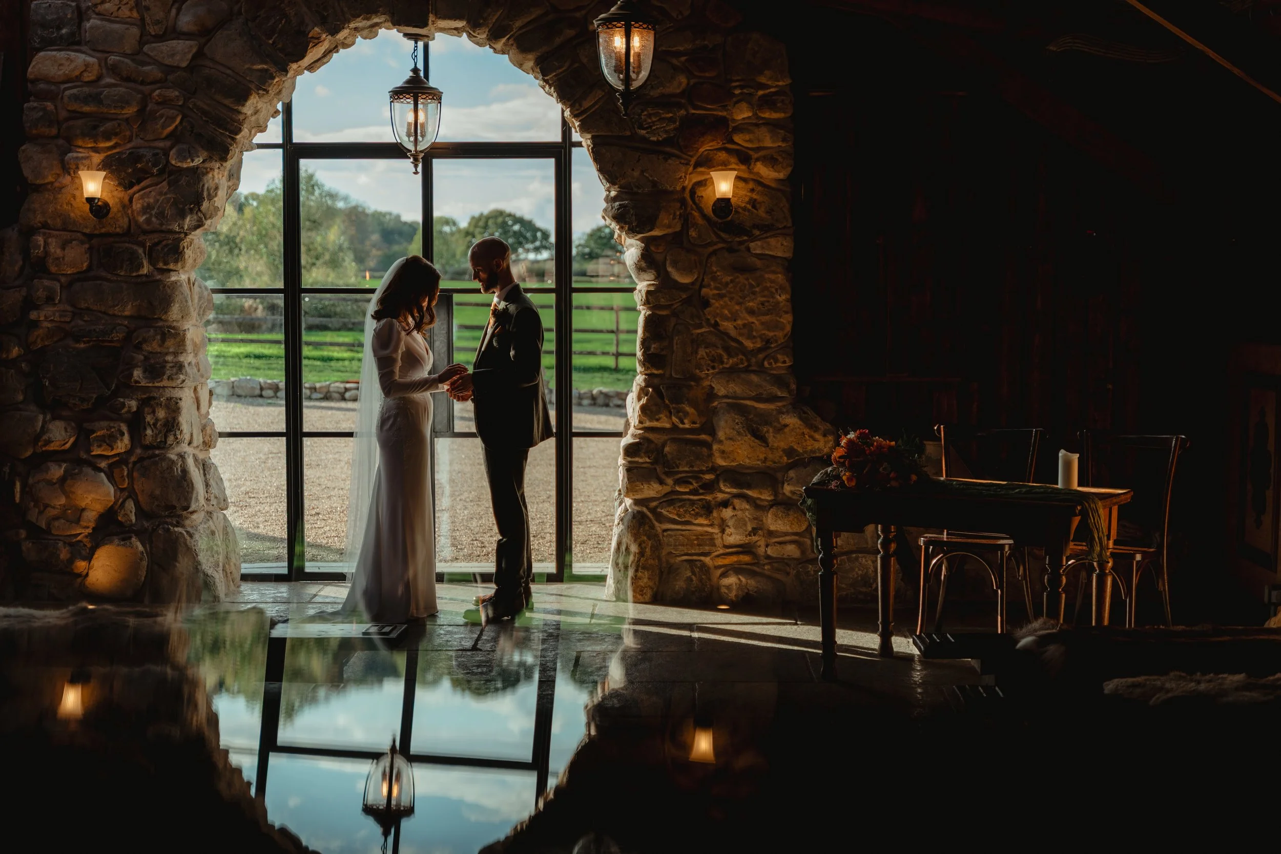 Contrast with shadow and light , couple in stone archway