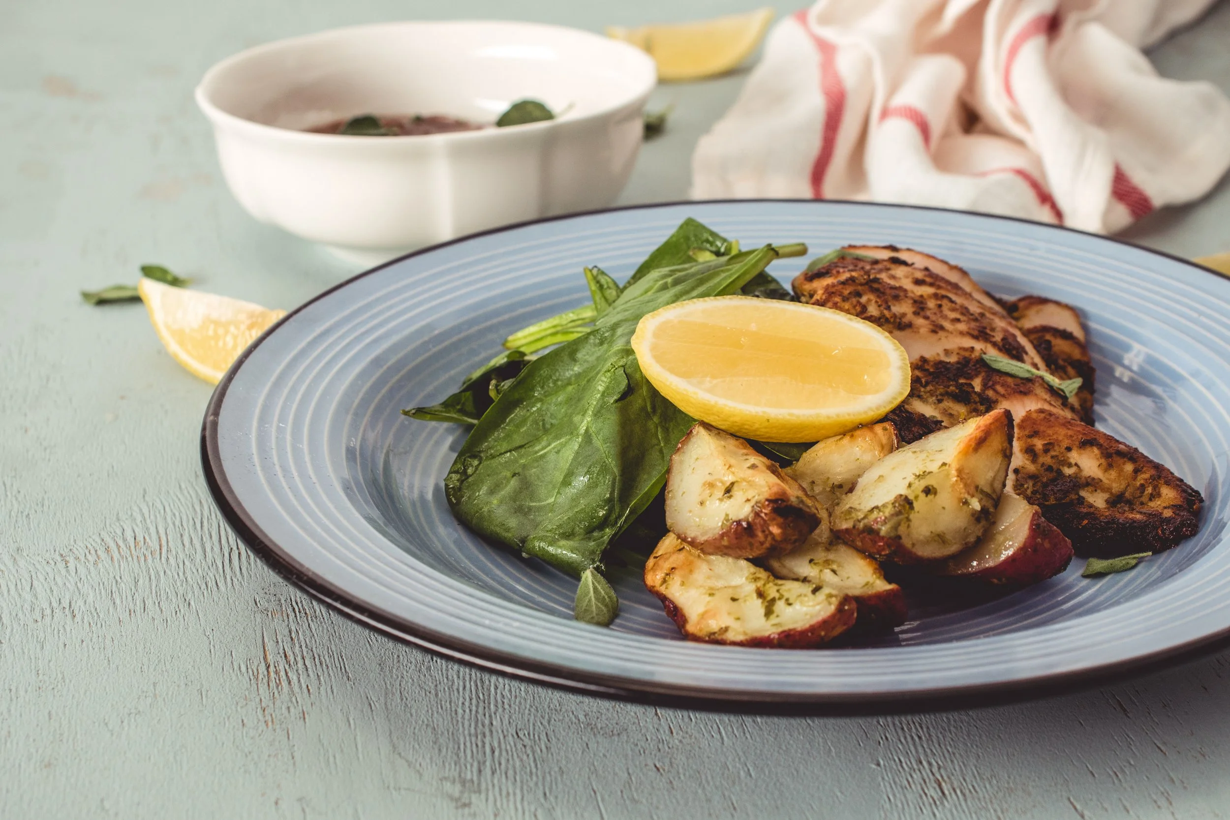  Roasted chicken served with rosemary potatoes.   