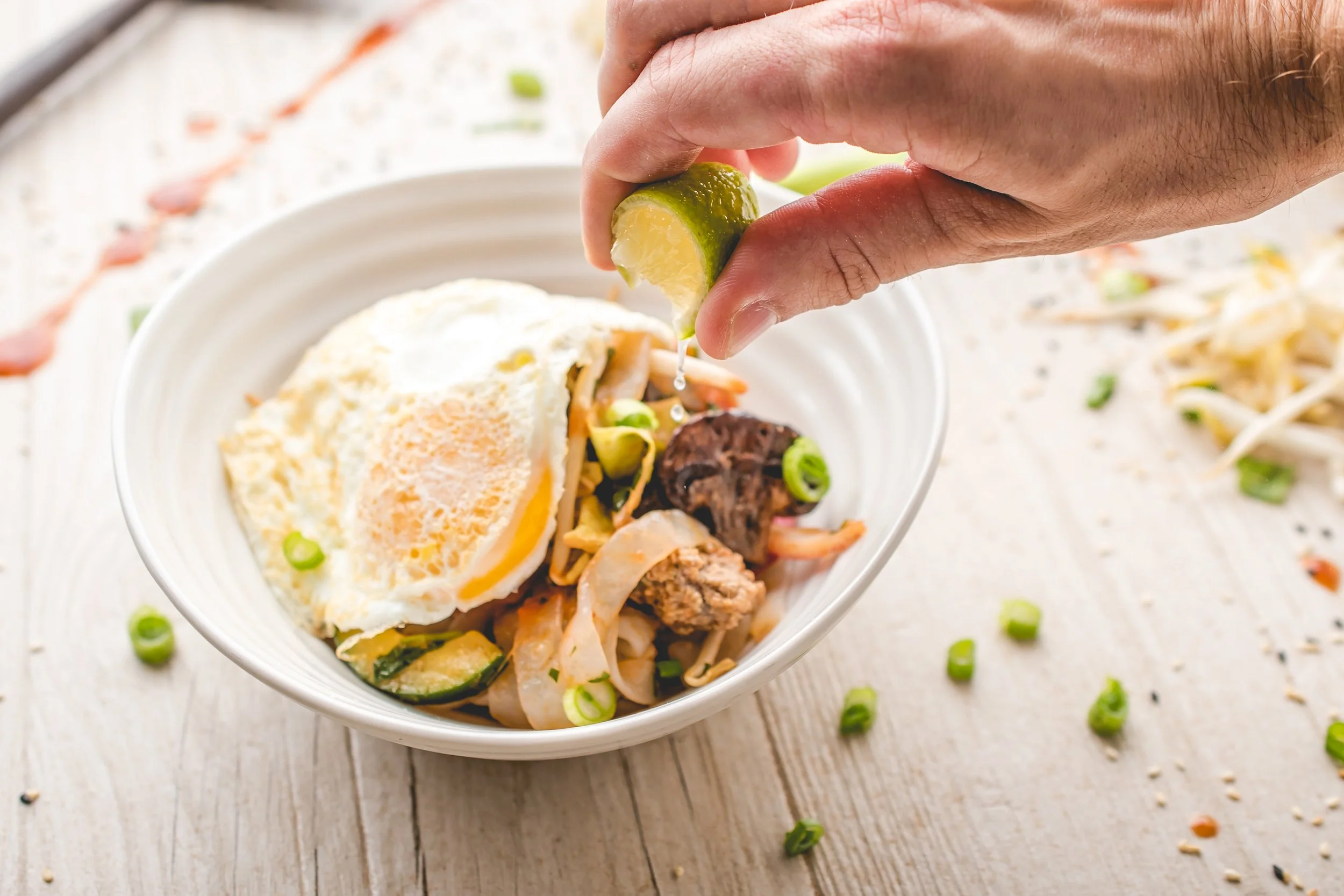  Egg noodles served with lime.   