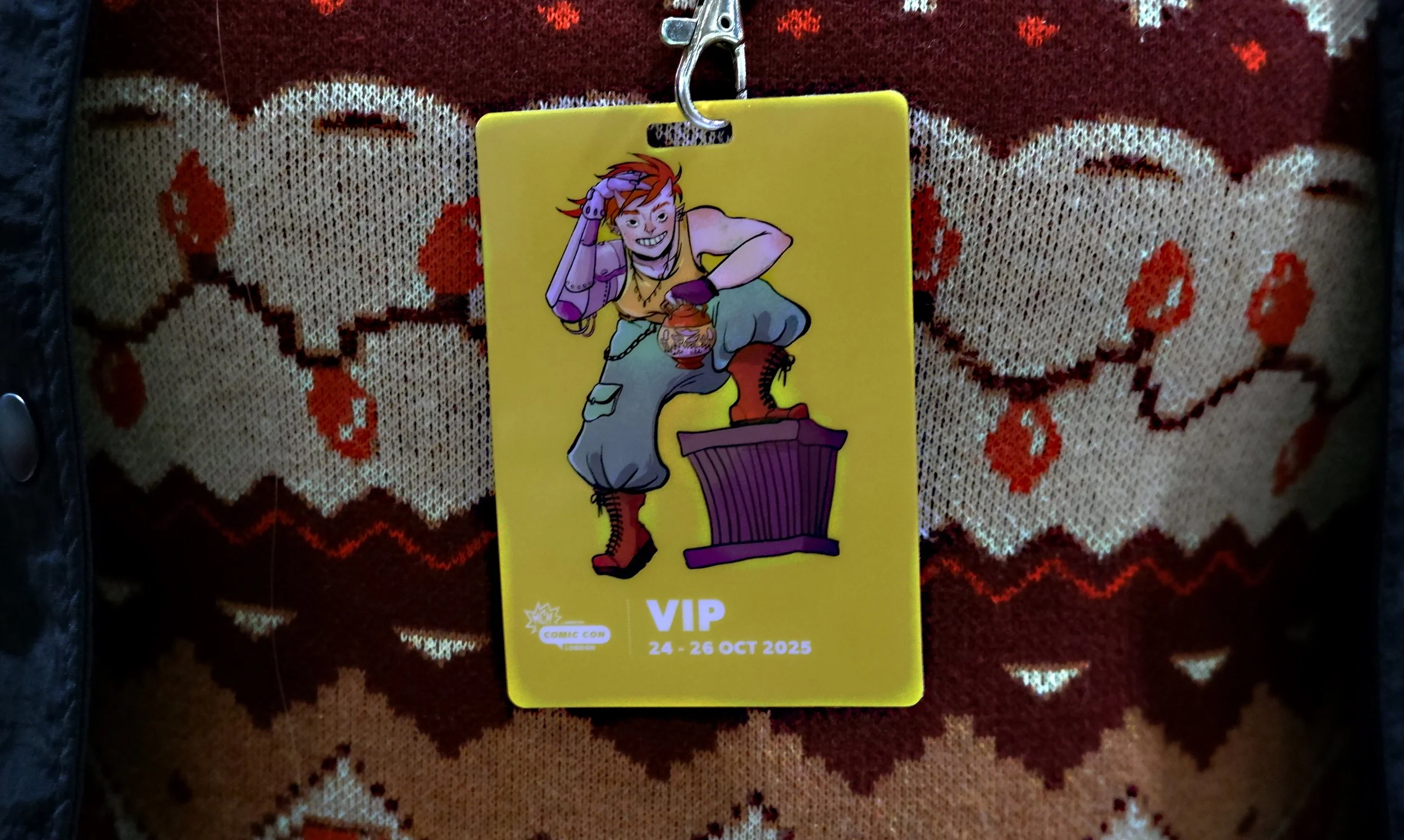 Photo of a VIP badge ticket from MCM Comic COn, featuring art by Pigeon.