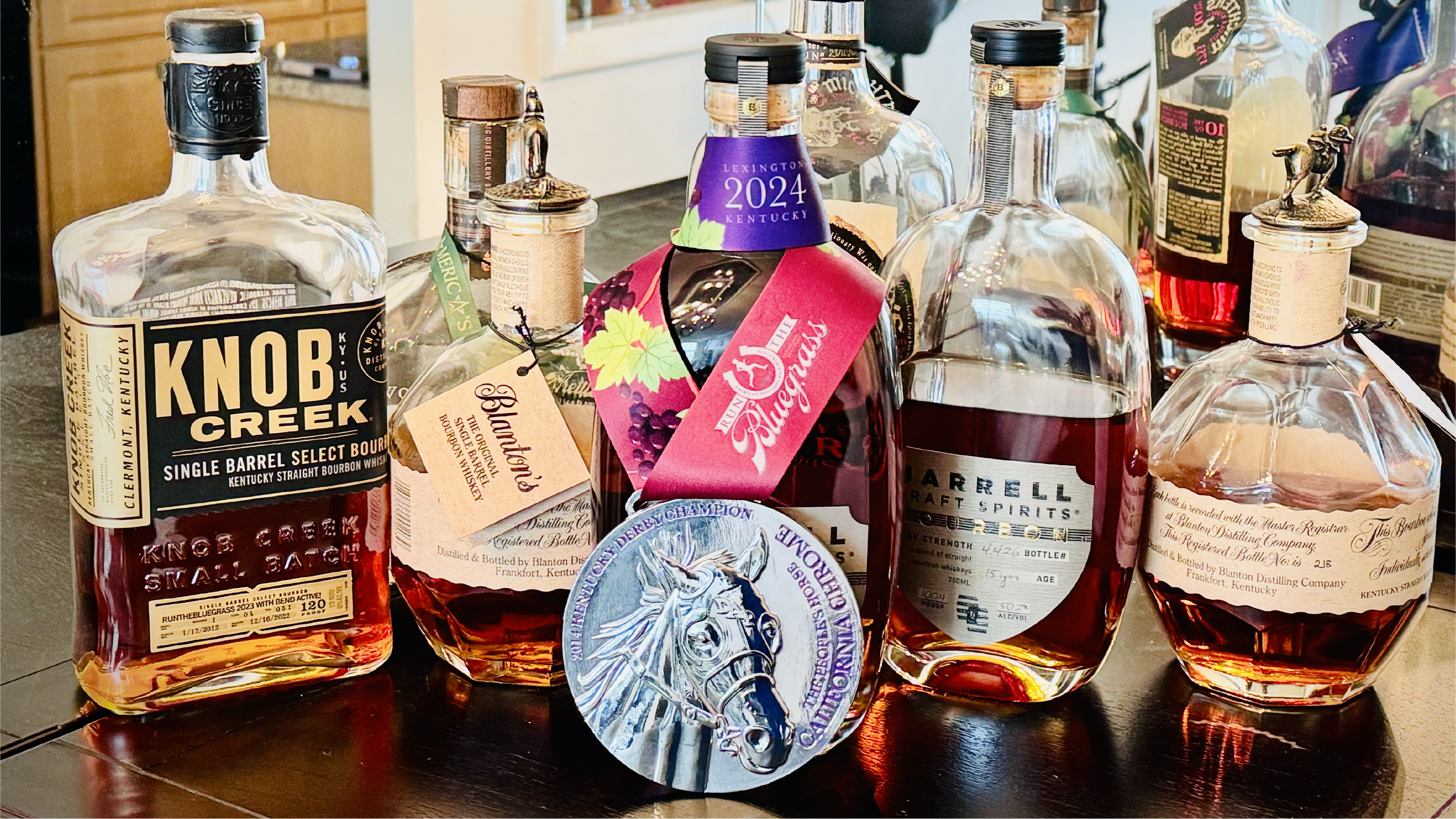 Medal Front on Bar -2 with other bottles.png