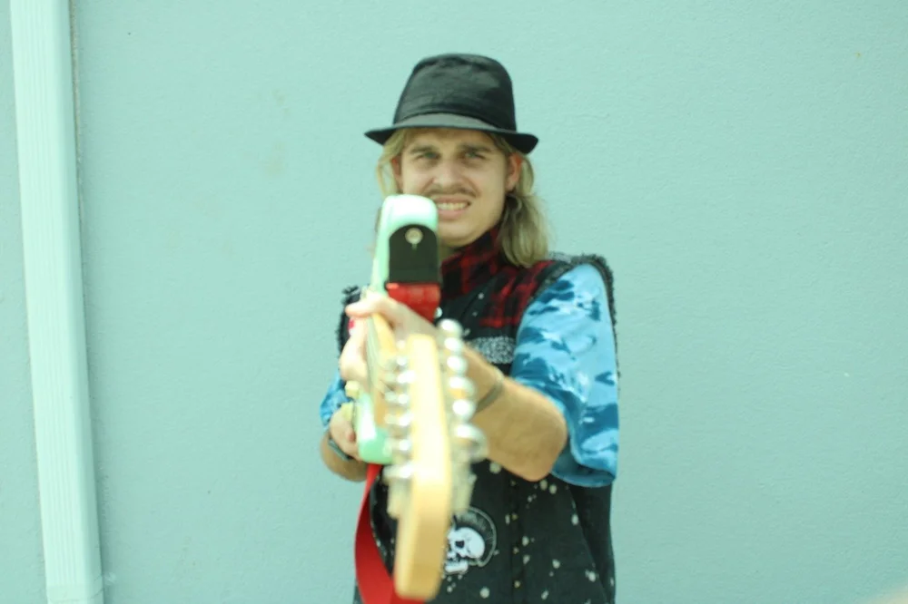 Max Pankey playing his seafoam green Fender Stratocaster