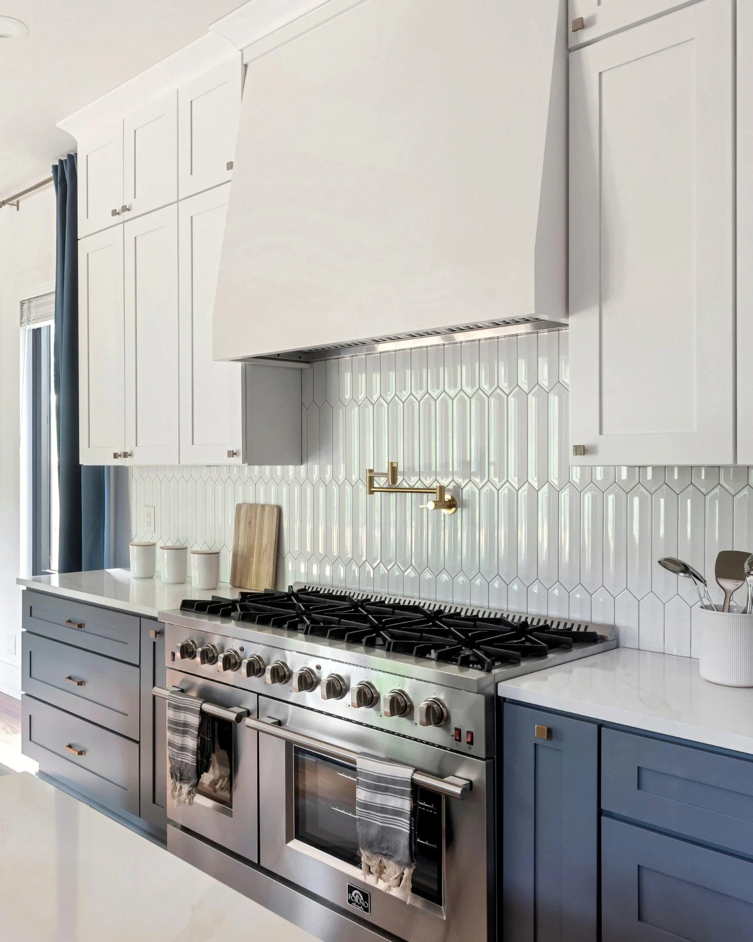 Kitchen range with custom tile and brass pot filler