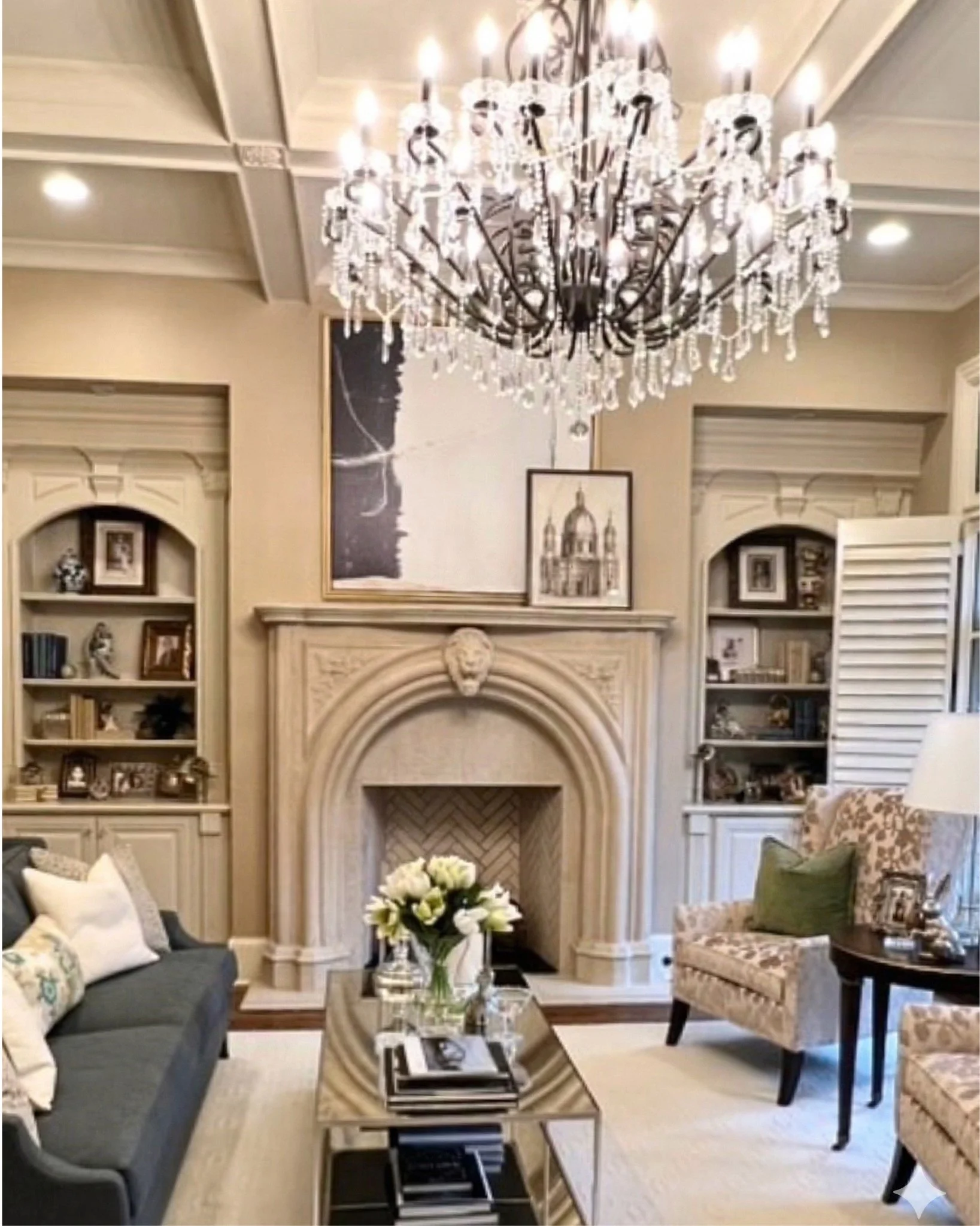 Elegant living room with chandelier and carved fireplace