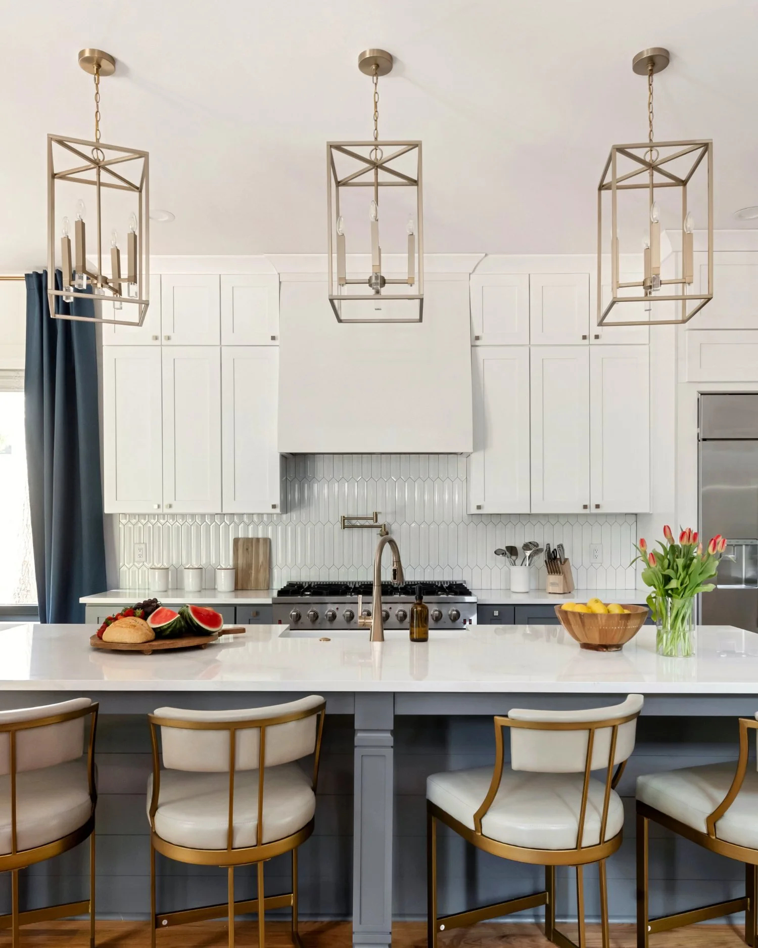 Monument Avenue kitchen with brass pendants and marble island