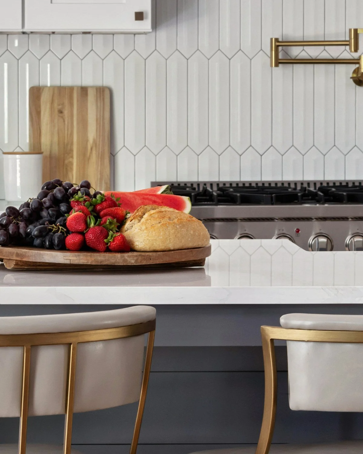 Kitchen styling detail with fruit and bread on island