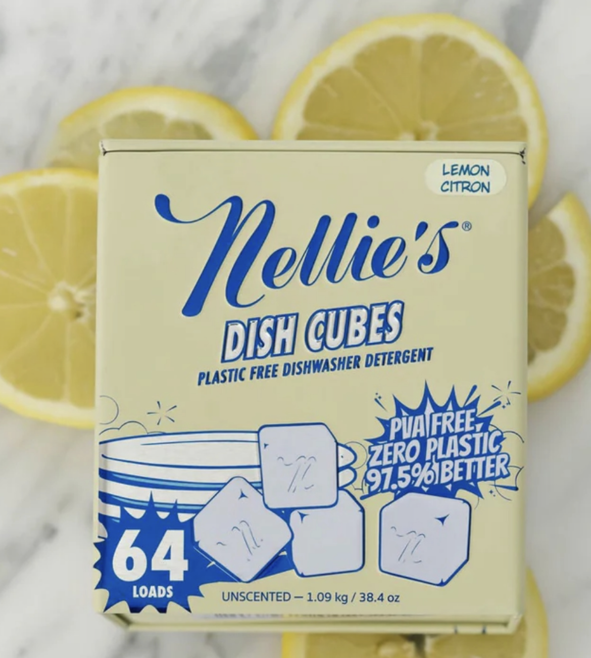 Image 2 Box of Nellie’s Lemon Dish Cubes, a plastic-free dishwasher detergent packaged in a reusable container, displayed with fresh lemon slices.