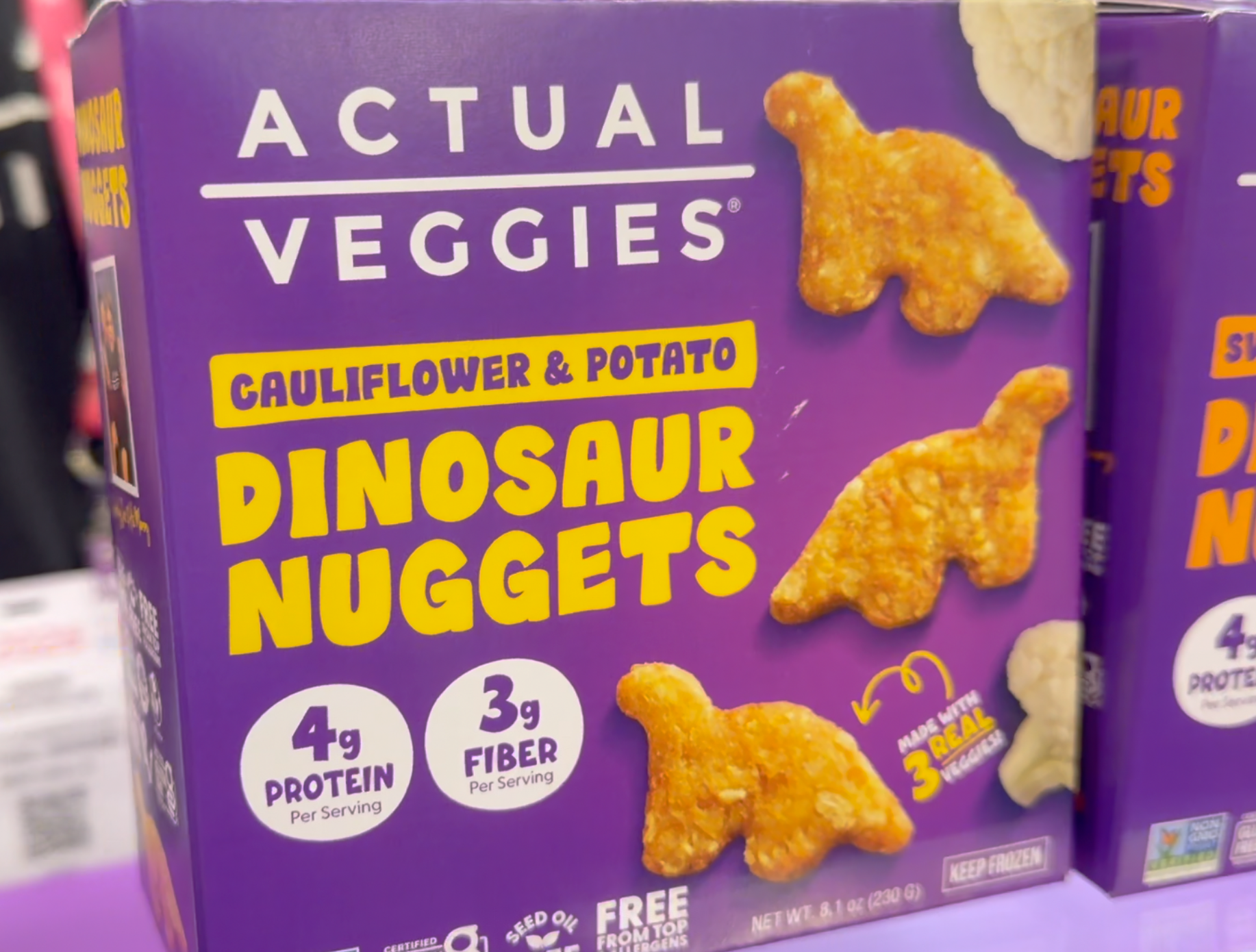 Actual Veggies Cauliflower and Potato Dinosaur Nuggets packaging showing dinosaur-shaped veggie nuggets with 4g protein and 3g fiber per serving, made with 3 real vegetables and free from top allergens.