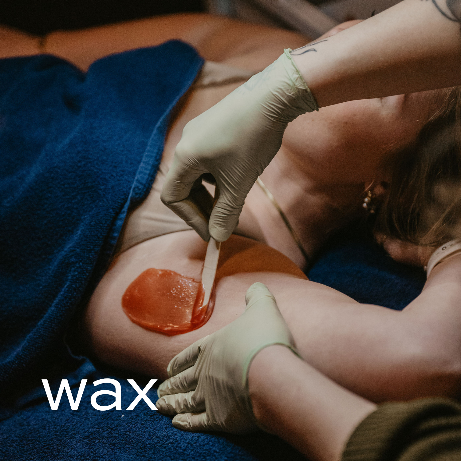 Client receiving an armpit waxing treatment.