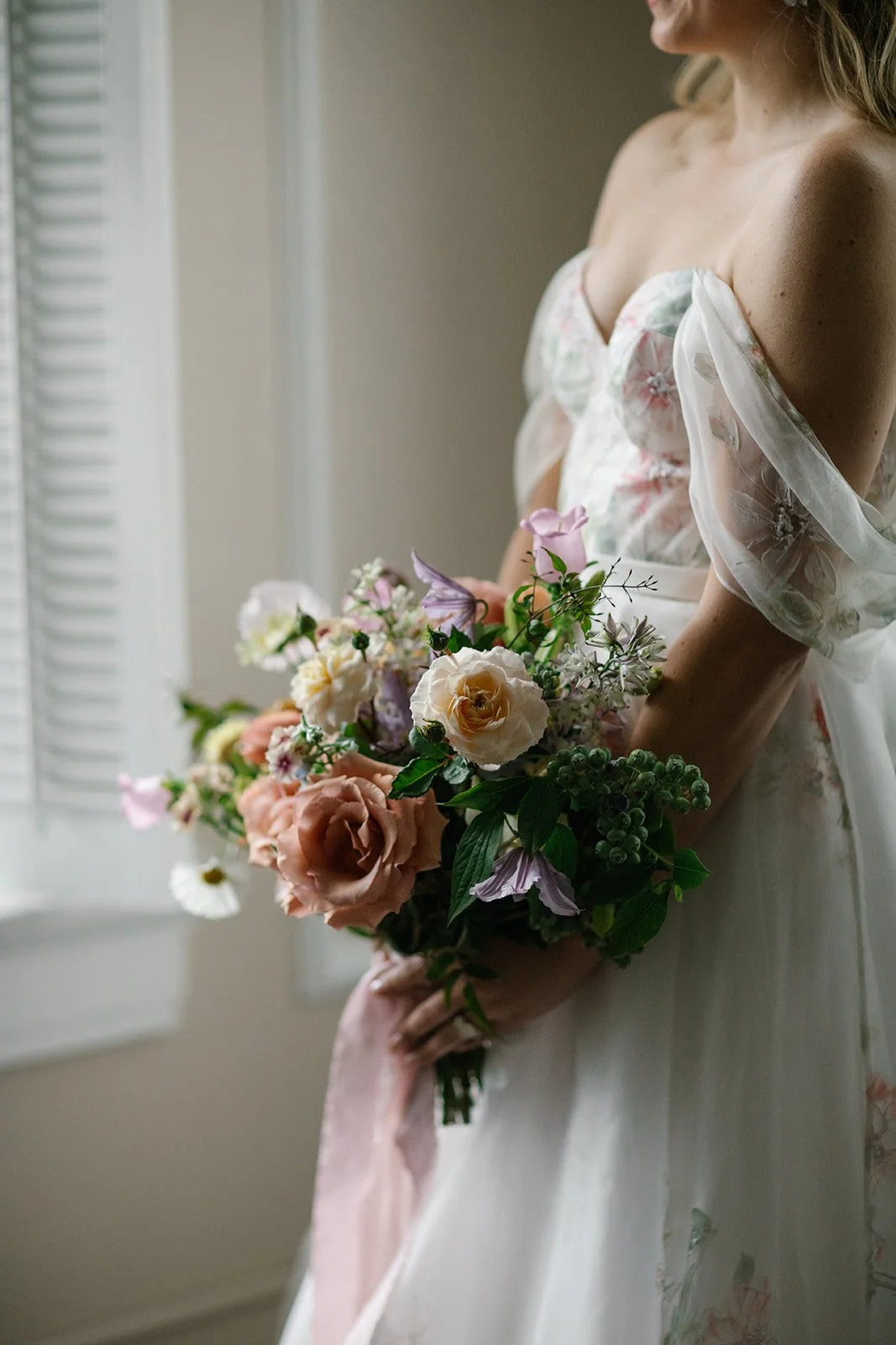 close up detail of a bride holding bouquet captured by a Nashville luxury wedding photographer