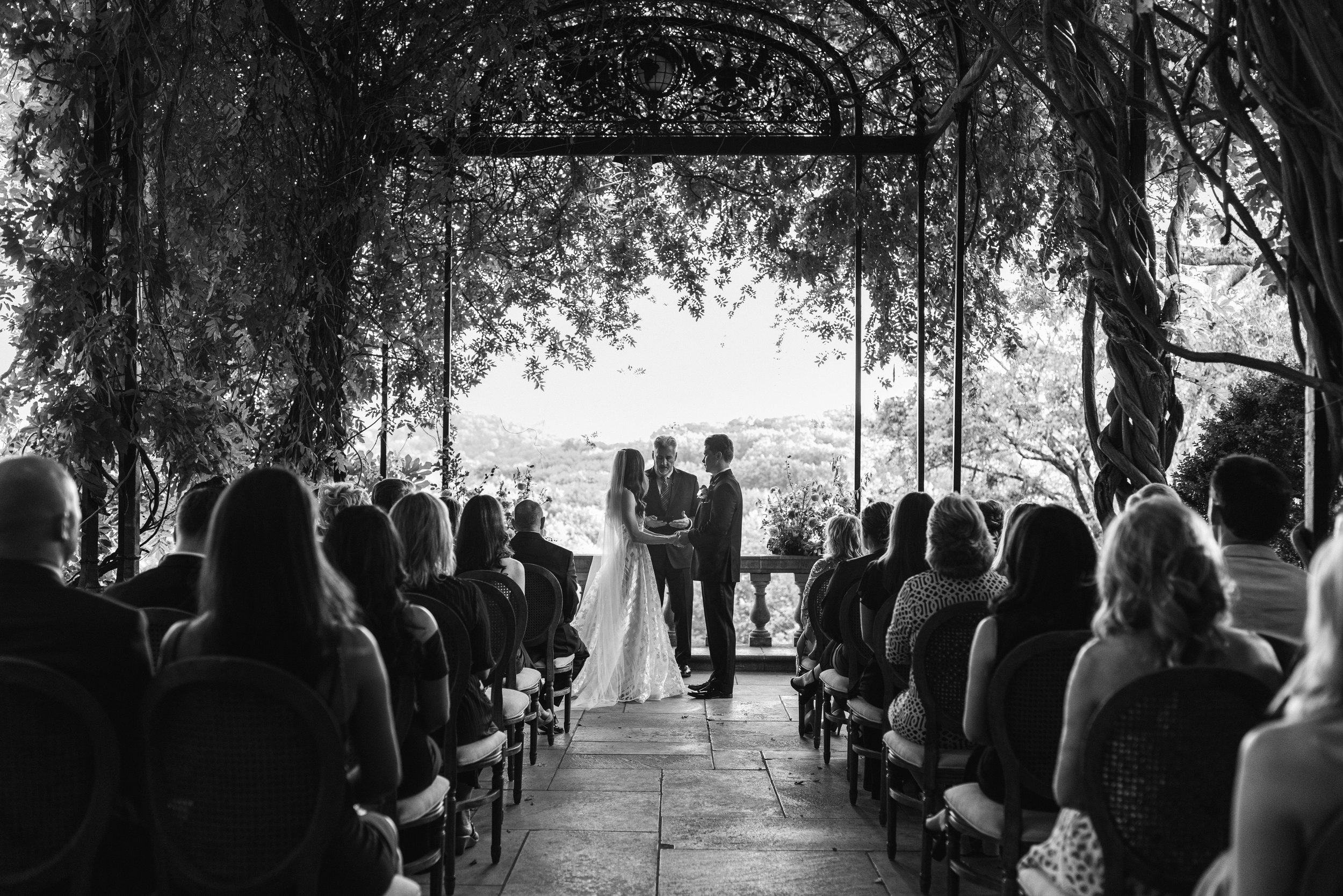 Wedding ceremony under the wisteria arbor at Cheekwood Botanical Gardens in Nashville, TN.