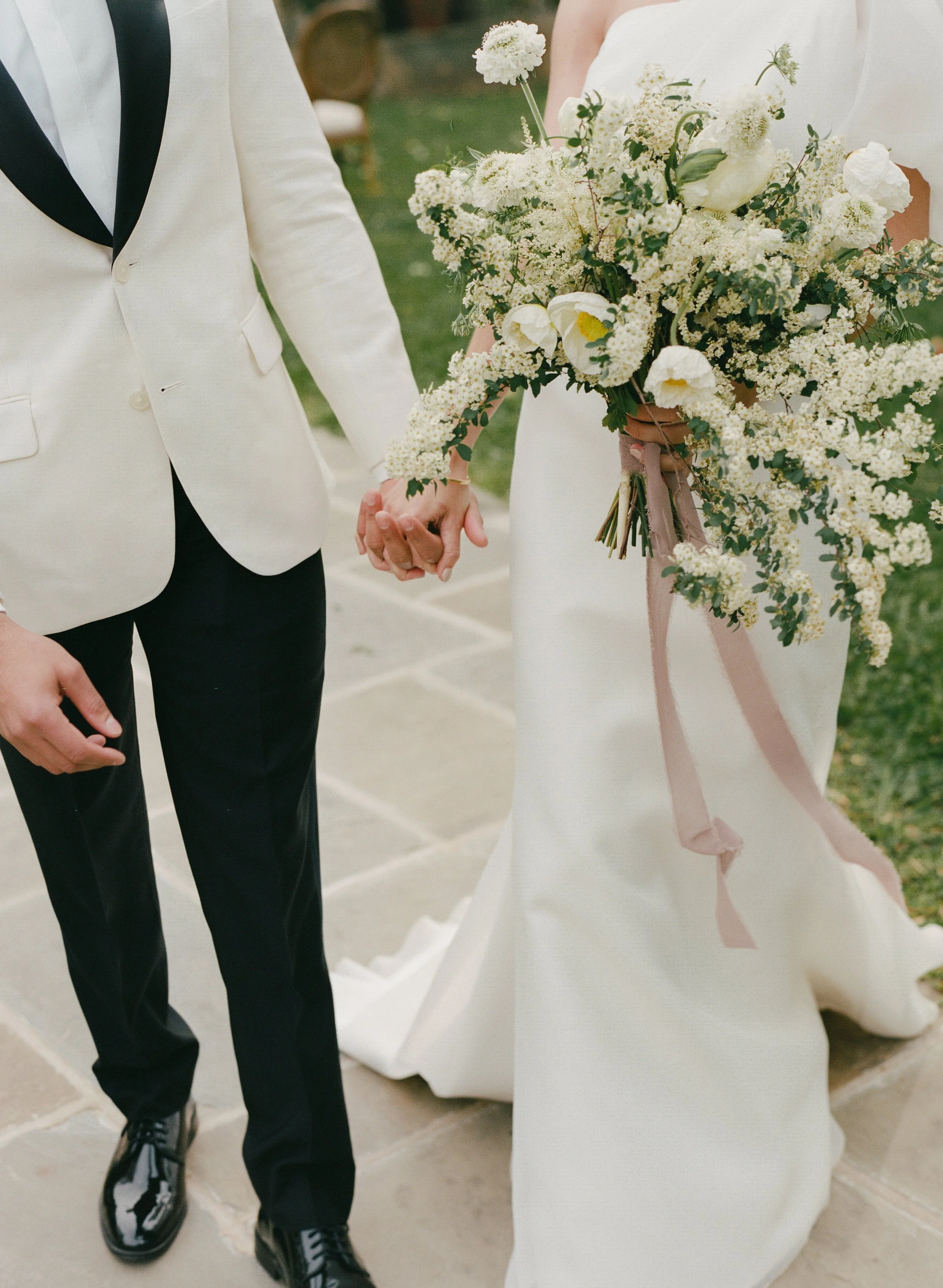 close up of bride and groom holding hands  captured by a Nashville wedding photographer