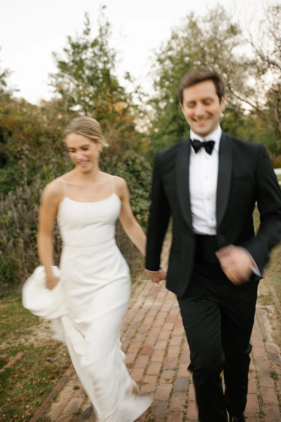 Joyful bride and groom at their woodlawn pope leighey house wedding in alexandria, va