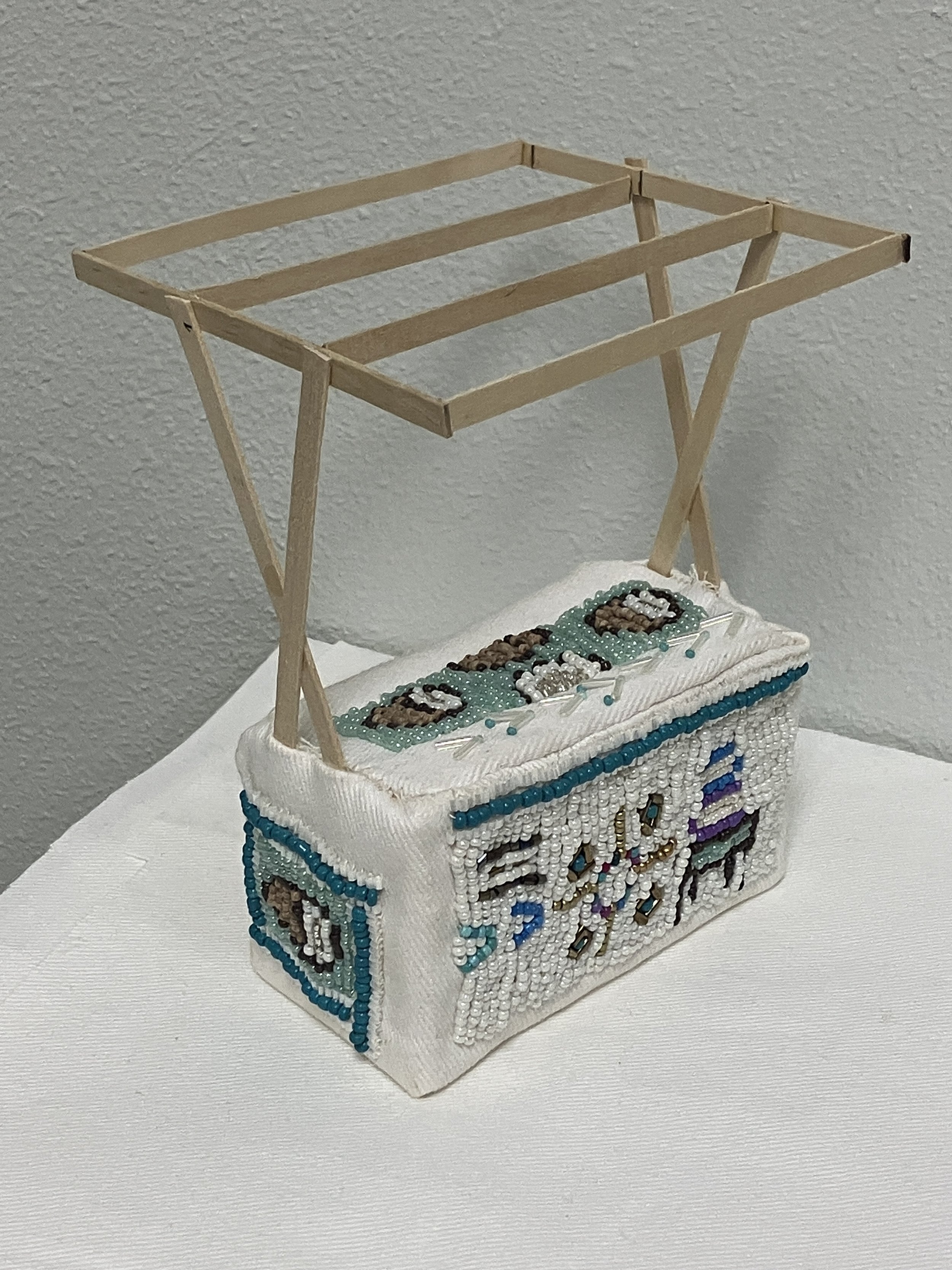 Matrilineal work: coconuts. Wood, beads, denim. 5 in x 4 in x 6.25 in. 2024