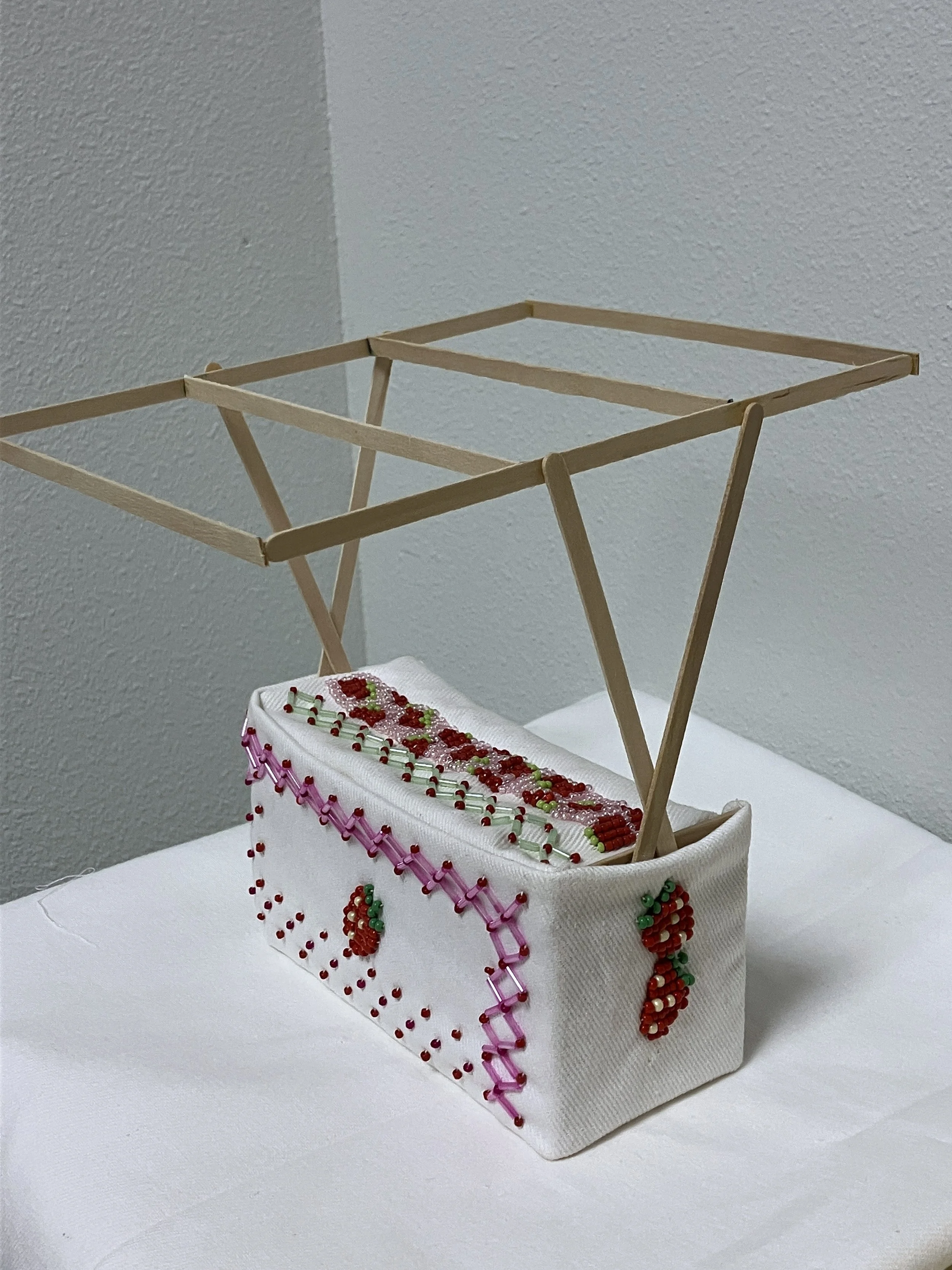 Matrilineal Work: Strawberries. Wood, beads, denim. 6 in x 8 in x 7 in. 2024.