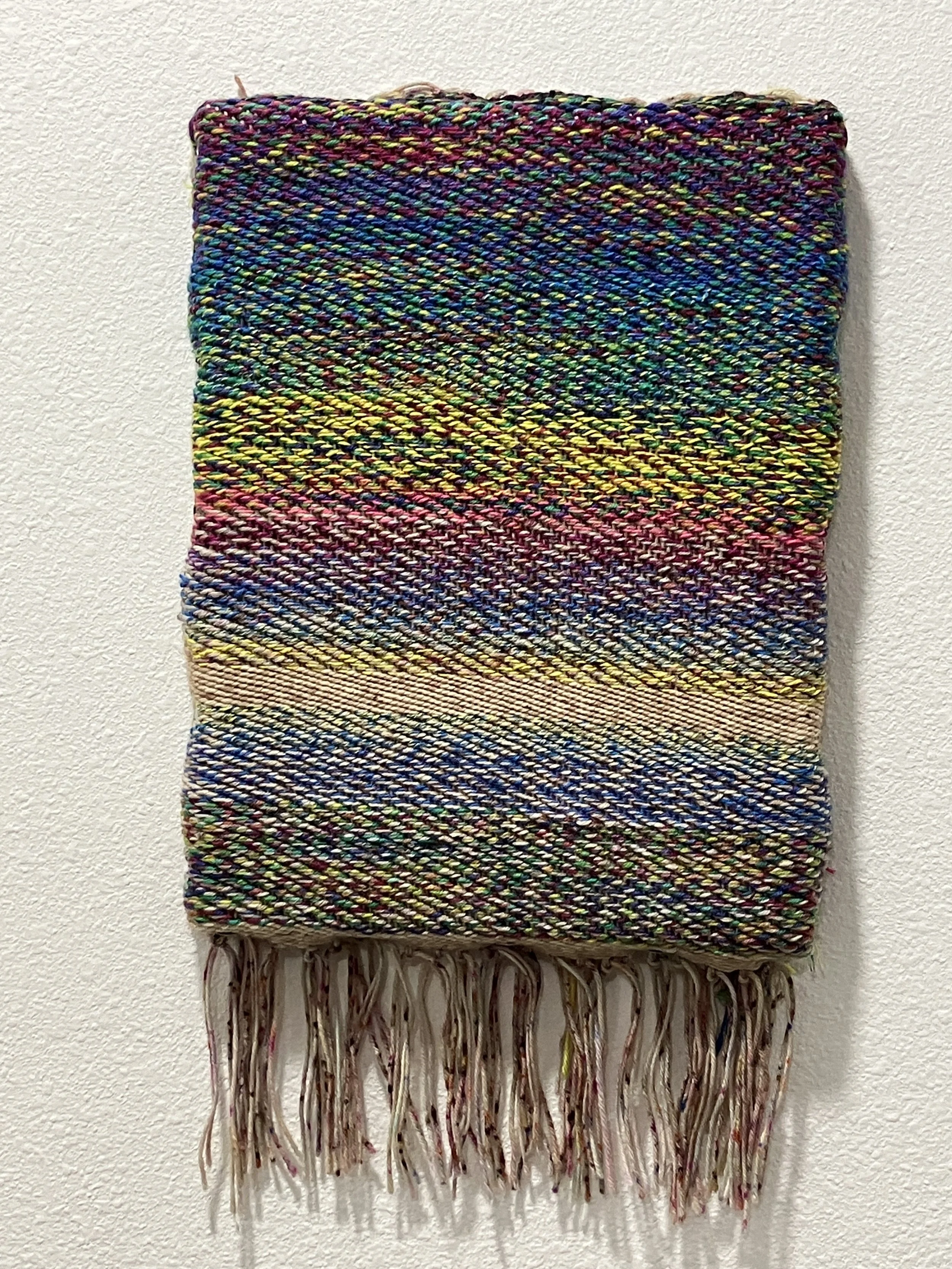 Oxumare. Cotton yarn and merino wool. Twill weave mounted on canvas. 9in x 12in. 2023.