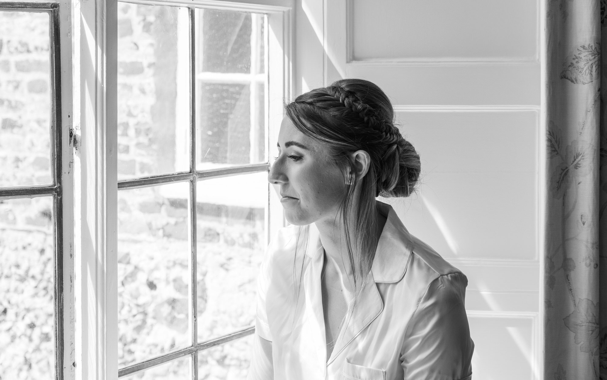  bride taking a moment during bridal prep 