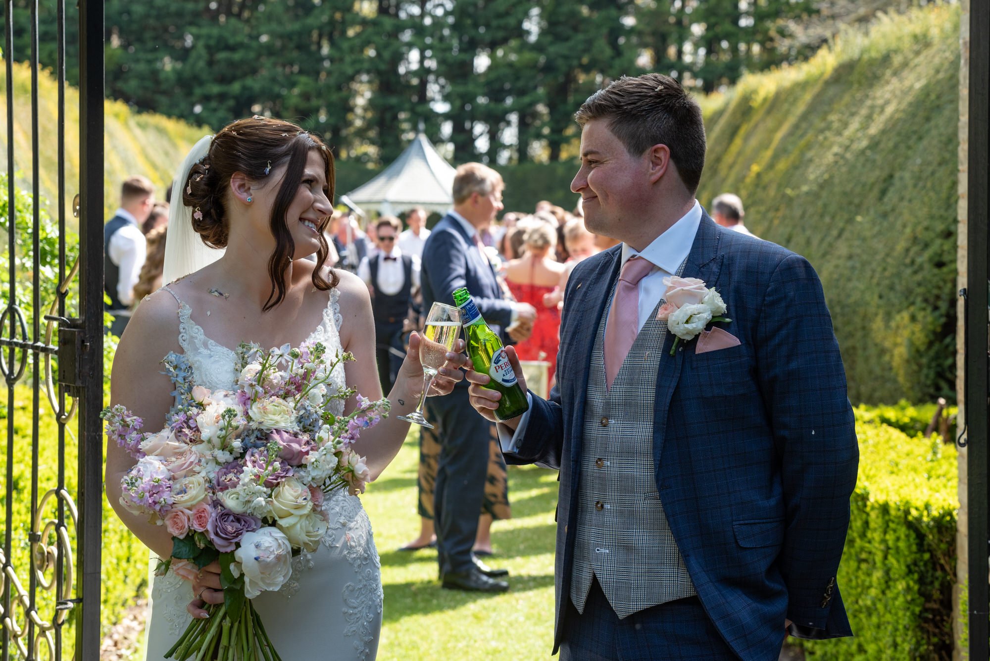  bride and groom sharing a first drink as husband and wife 