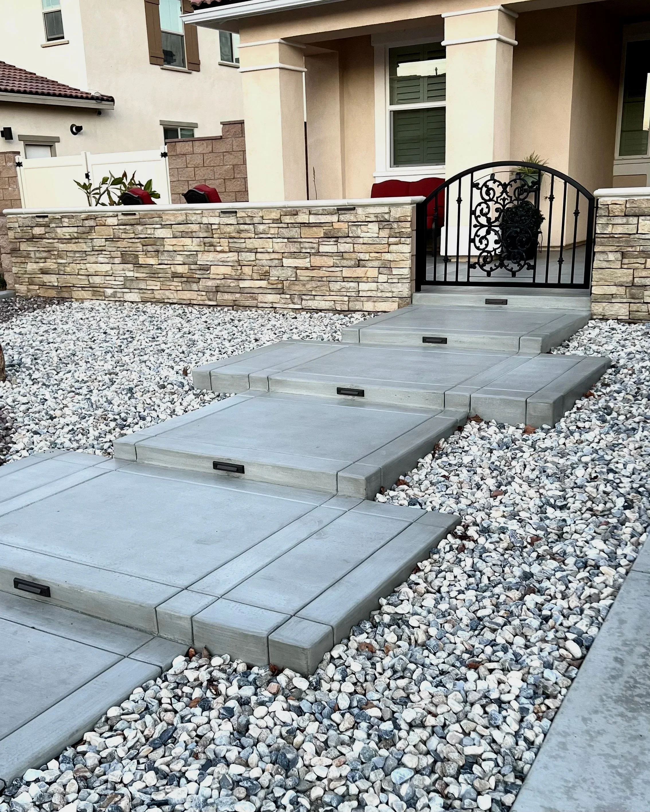 front-entry-custom-concrete-steps-block-wall-gate