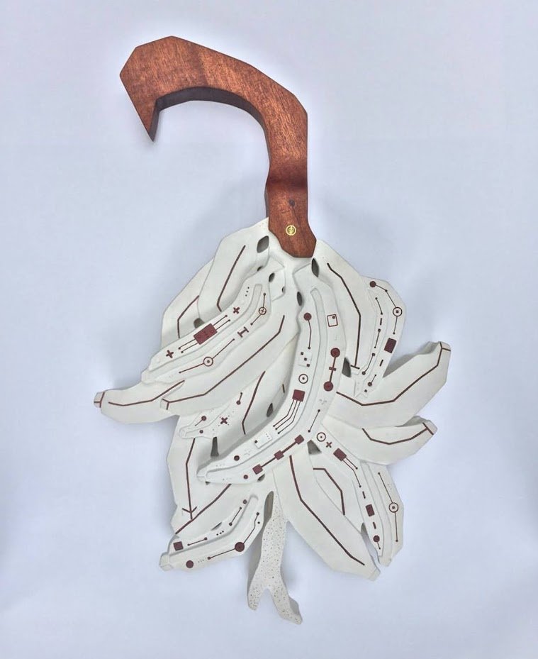 "¿Plátanos? II" ("Plantains? II") Ceramic, red iron oxide and reclaimed mahogany wood. (2019). 16" x 27" x 3 1/2"