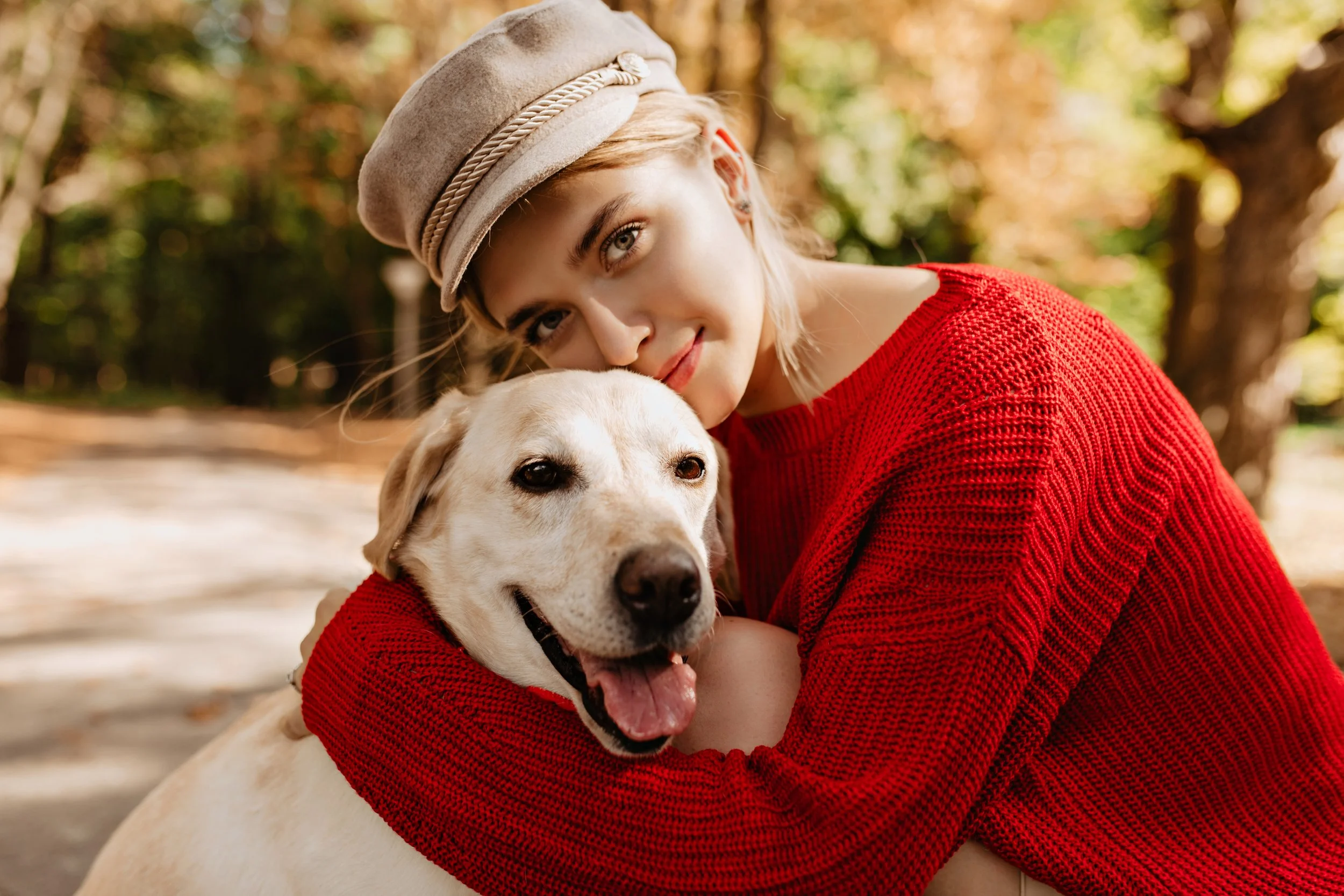 lovely-young-girl-nice-trendy-red-pullover-hugging-labrador-forest-pretty-blonde-light-hat-with-her-dog-sitting-park.jpg