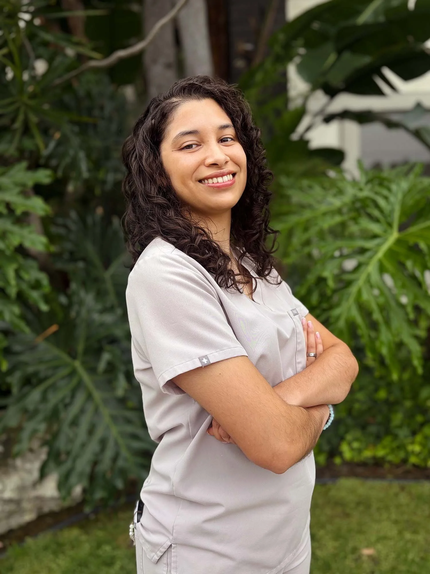 Professional headshot of Xitlali, Ayamluz Wellness Practitioner Assistant, smiling
