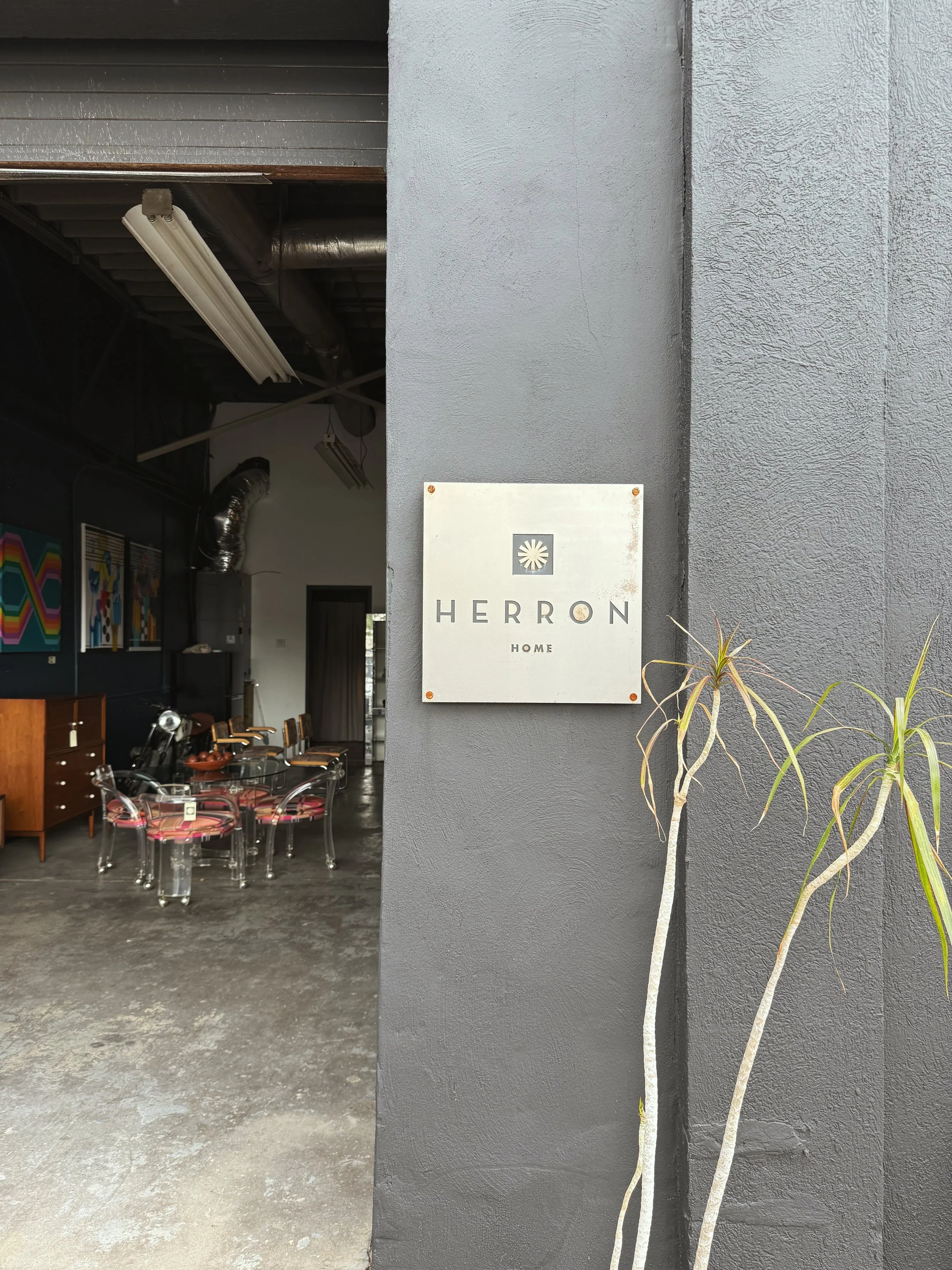 Herron Home sign at their warehouse in Nashville, Tennesee. unique and curated vintage and modern furniture and art