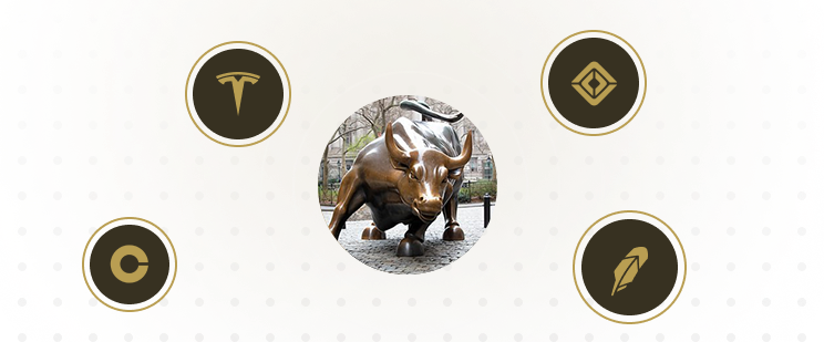 Bitcoin, Tesla, Coinbase, and Robinhood logos surrounding the Charging Bull statue at Bowling Green Park in New York City.