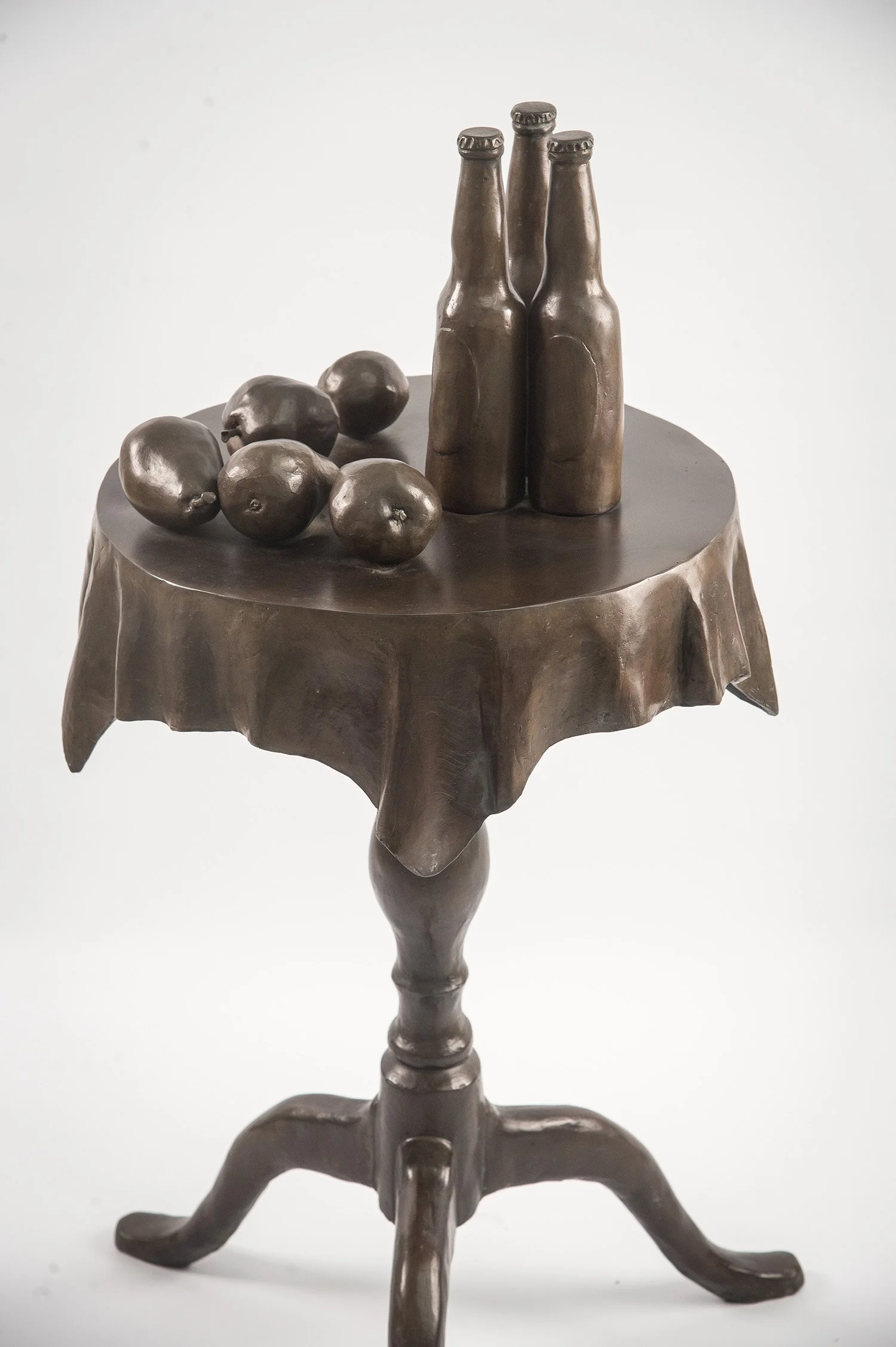 Still Life IX life size bronze sculpture table with cloth bottles and fruit