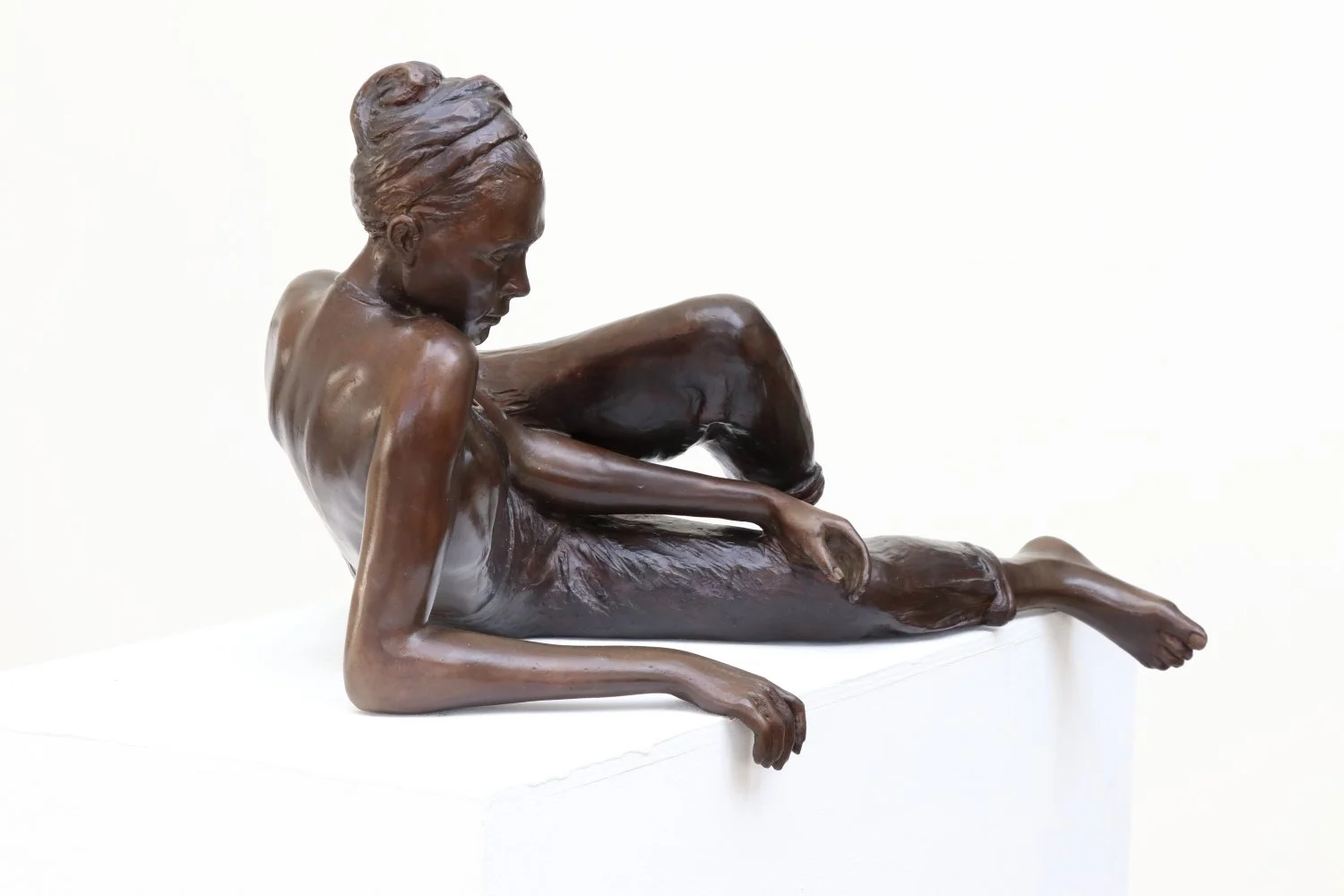 Young Woman Reclining Study small bronze sculpture of female figure reclining